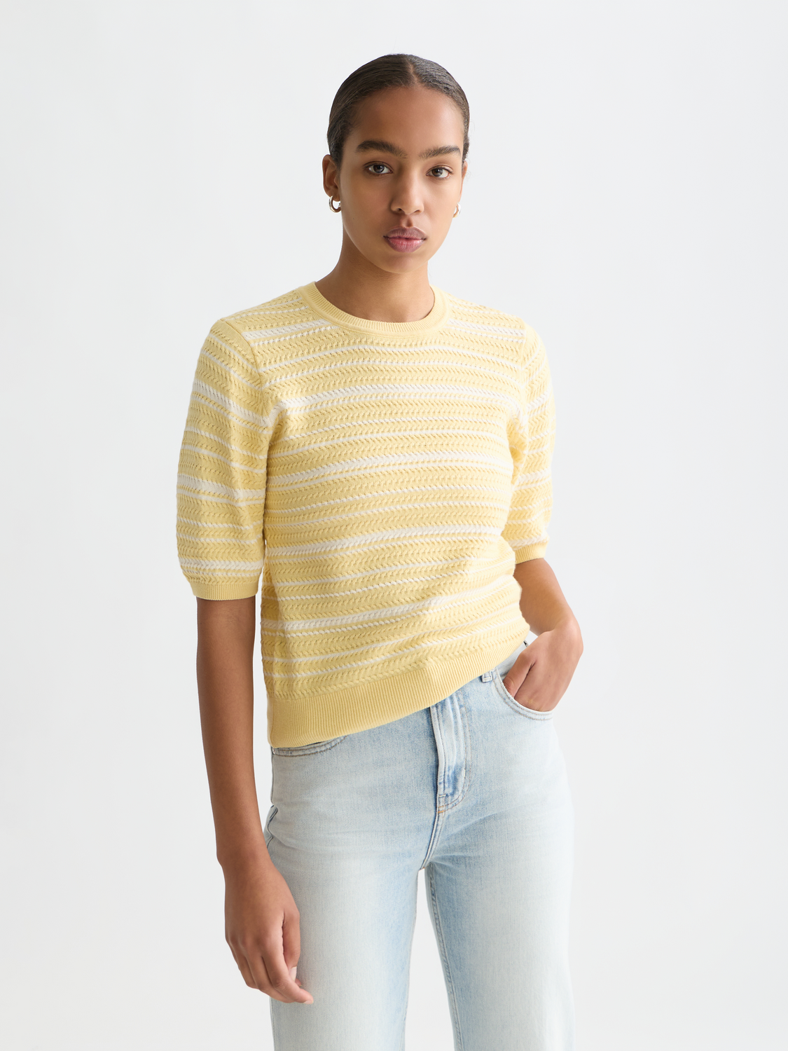 Striped knitted T-shirt by Scotch & Soda featuring a classic knitwear design and multicolor horizontal stripes.
