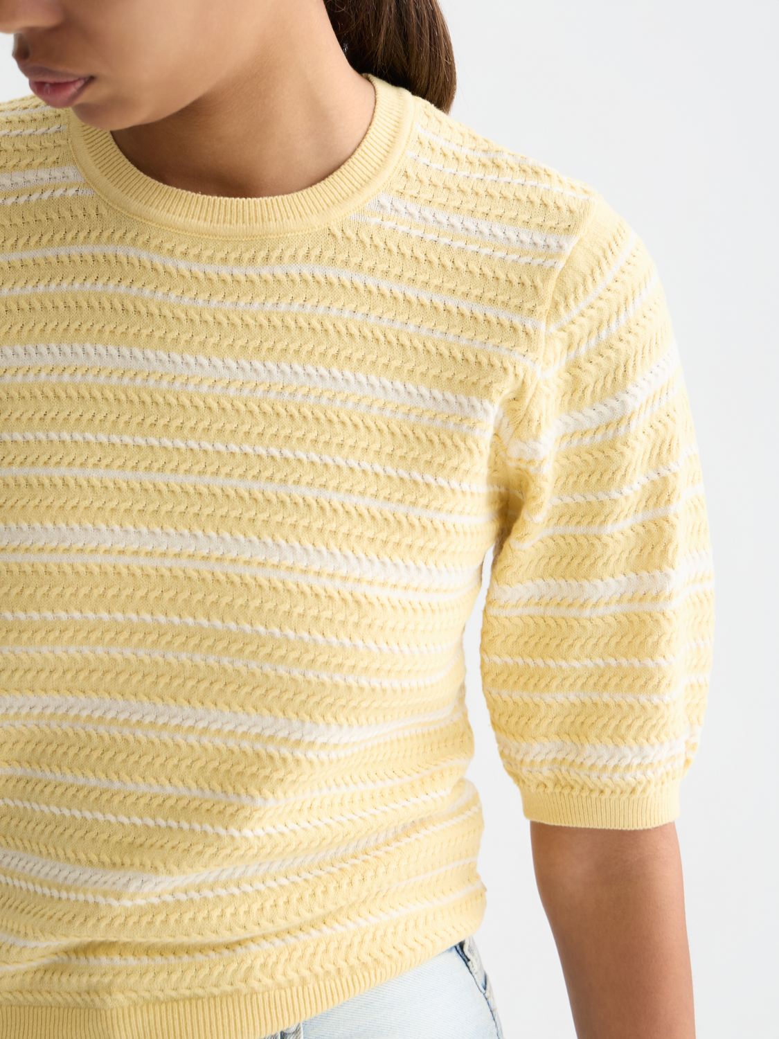 Striped knitted T-shirt from Scotch & Soda featuring a classic knitwear design with multicolor stripes and a comfortable fit.