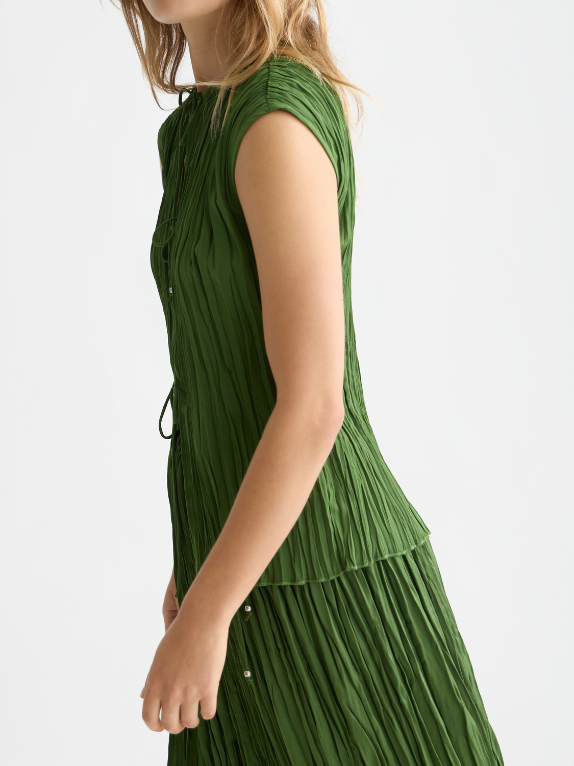 Printed pleat woven top by Scotch & Soda, featuring a stylish design with pleats and vibrant print, shown on a model.