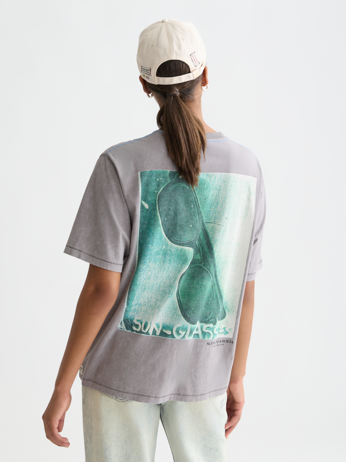 Short sleeve Scotch & SODA t-shirt featuring a Basquiat artwork print on the front, casual and artistic design.