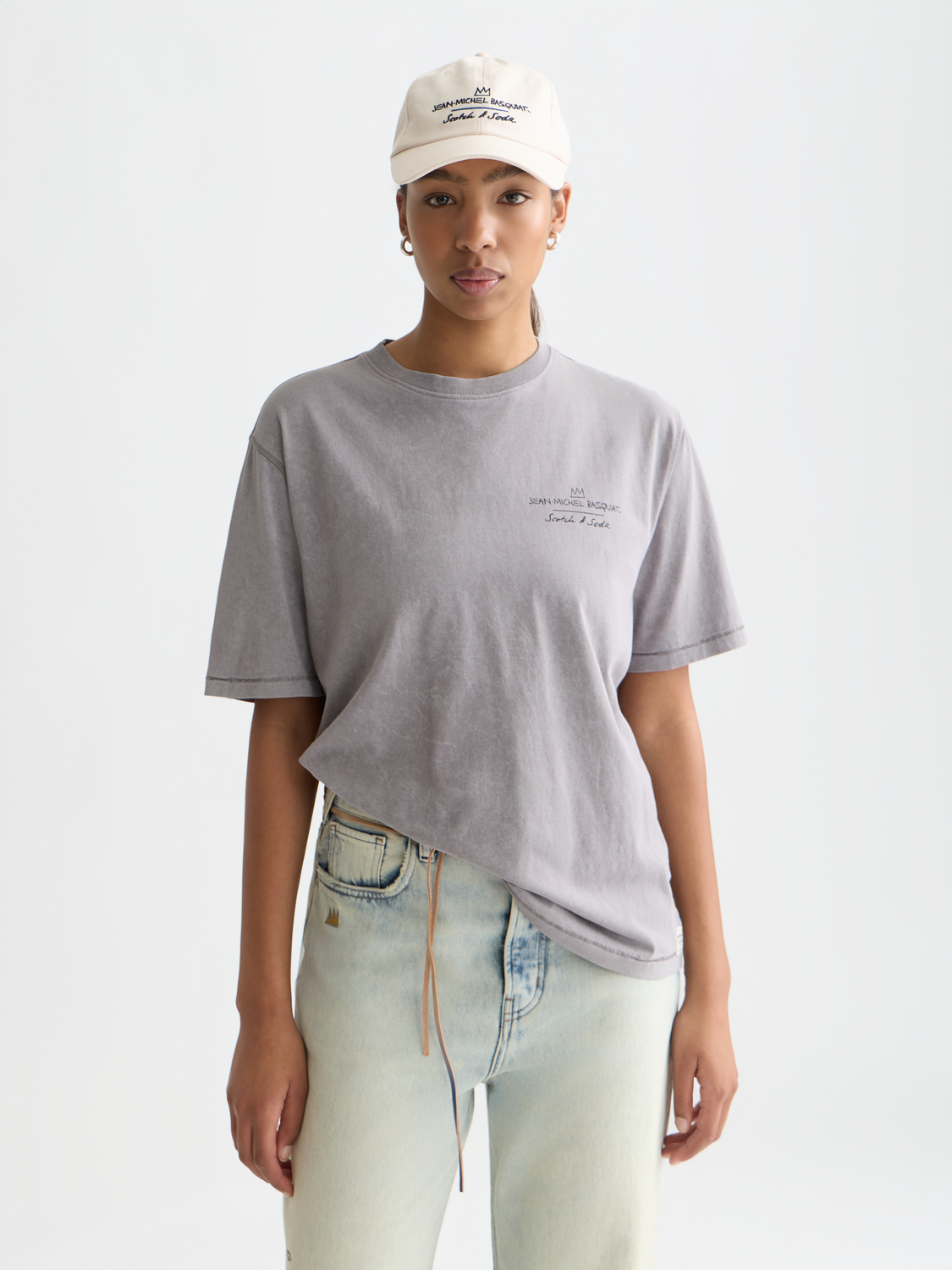 Short sleeve Scotch & Soda t-shirt featuring Jean-Michel Basquiat artwork with bold graphic print on front.