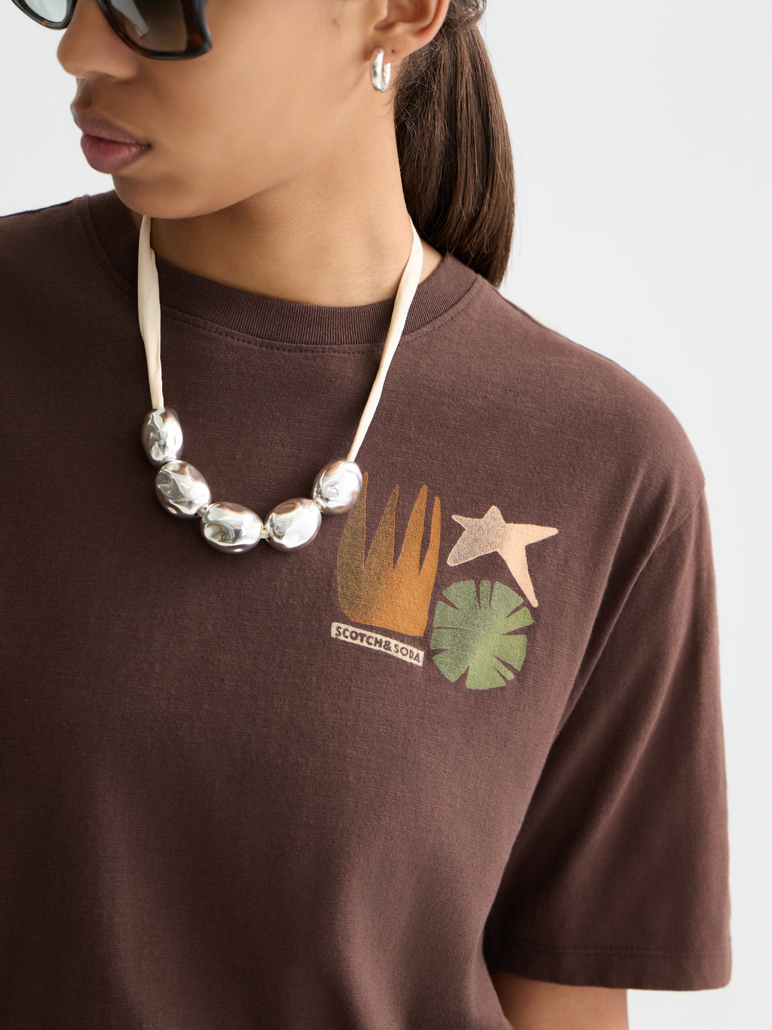 Scotch & Soda short sleeve artwork t-shirt featuring colorful graphic print on soft cotton fabric.