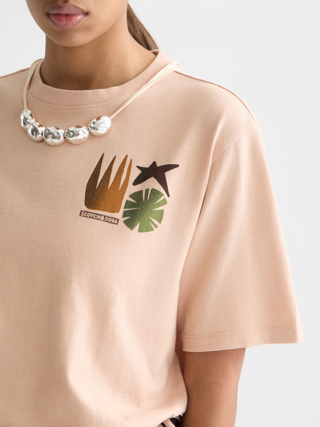 Short-sleeve Scotch & Soda artwork T-shirt featuring colorful graphic print on soft fabric.