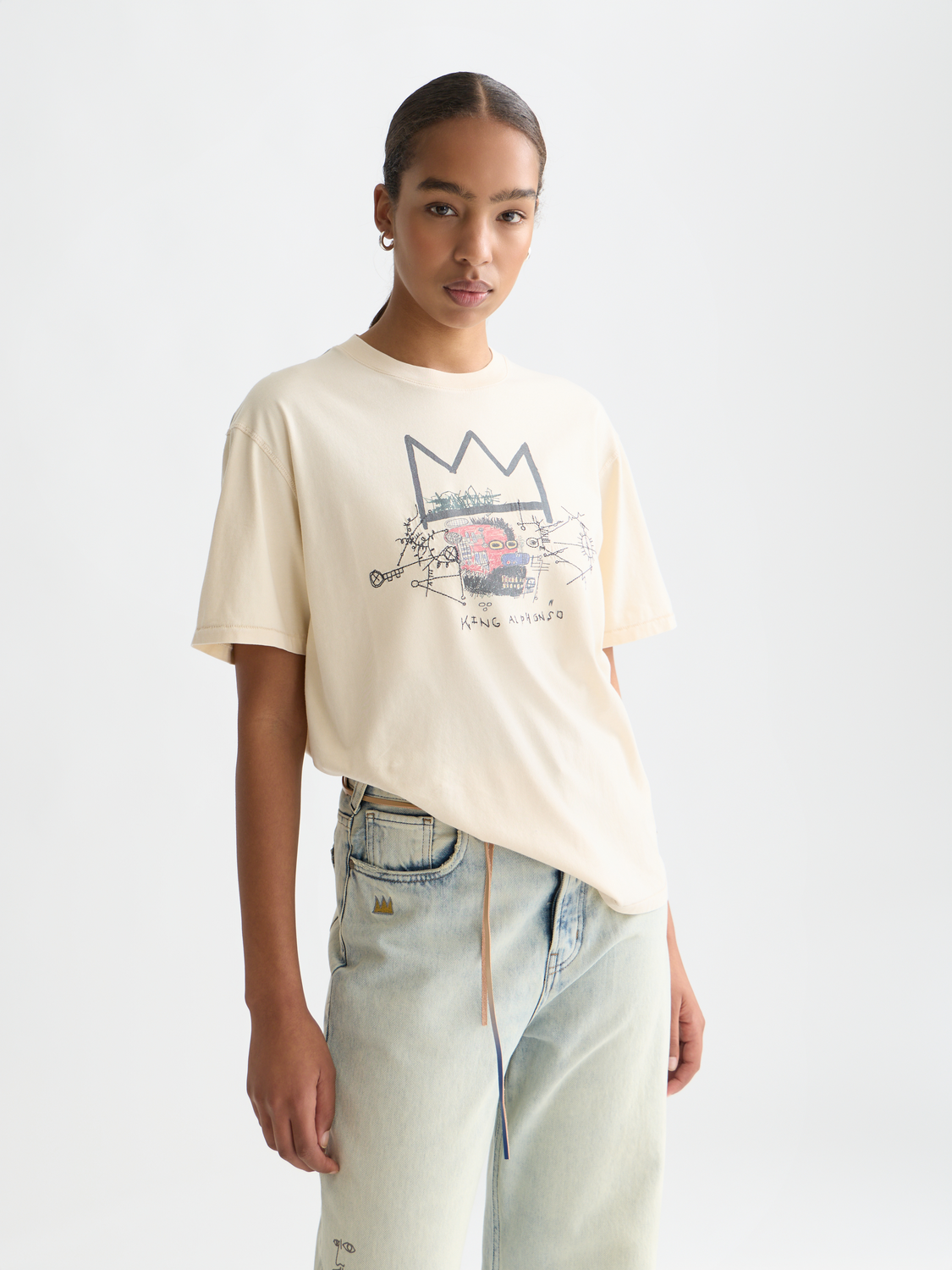 Scotch & Soda short sleeve t-shirt featuring washed artwork inspired by Basquiat with bold graphic design on front.
