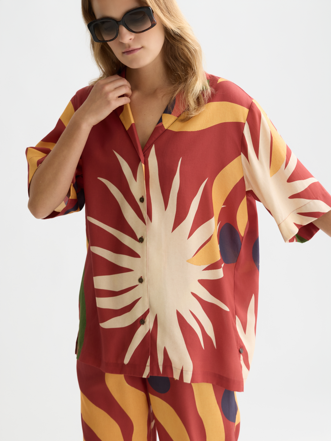 Printed short-sleeved shirt by Scotch & Soda featuring vibrant patterns and casual fit, displayed on a model.