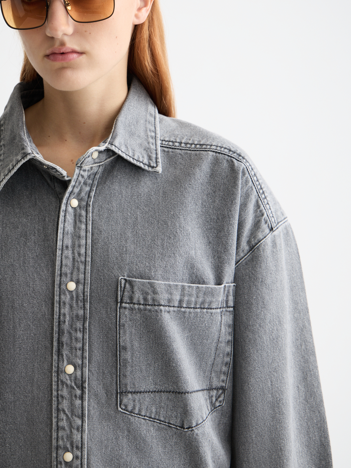Light washed denim overshirt from Scotch & Soda, long-sleeve shirt with a casual, relaxed fit and classic denim texture.