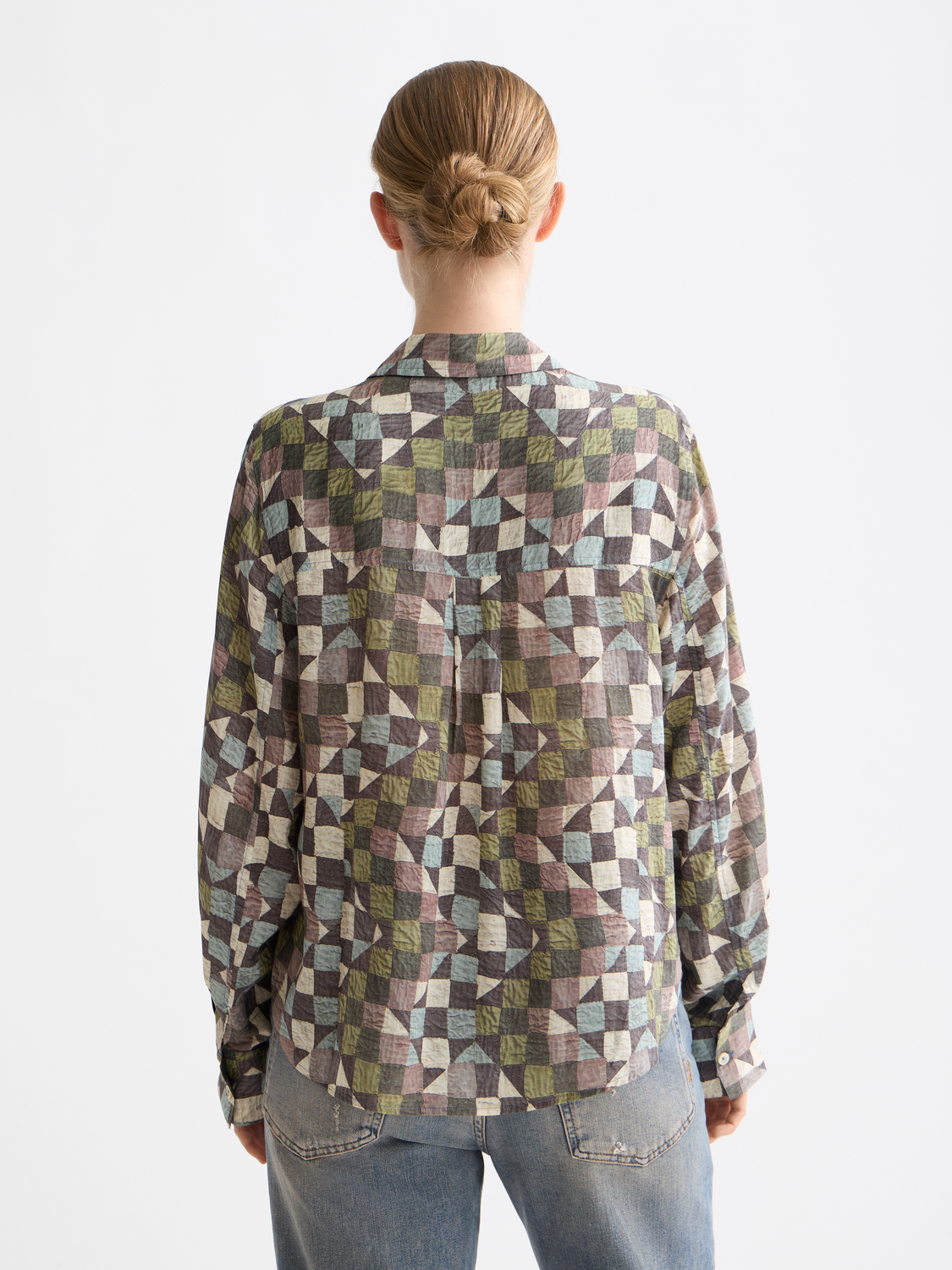 Long-sleeve printed shirt by Scotch & Soda, featuring bold patterns and a relaxed fit, shown on a model.