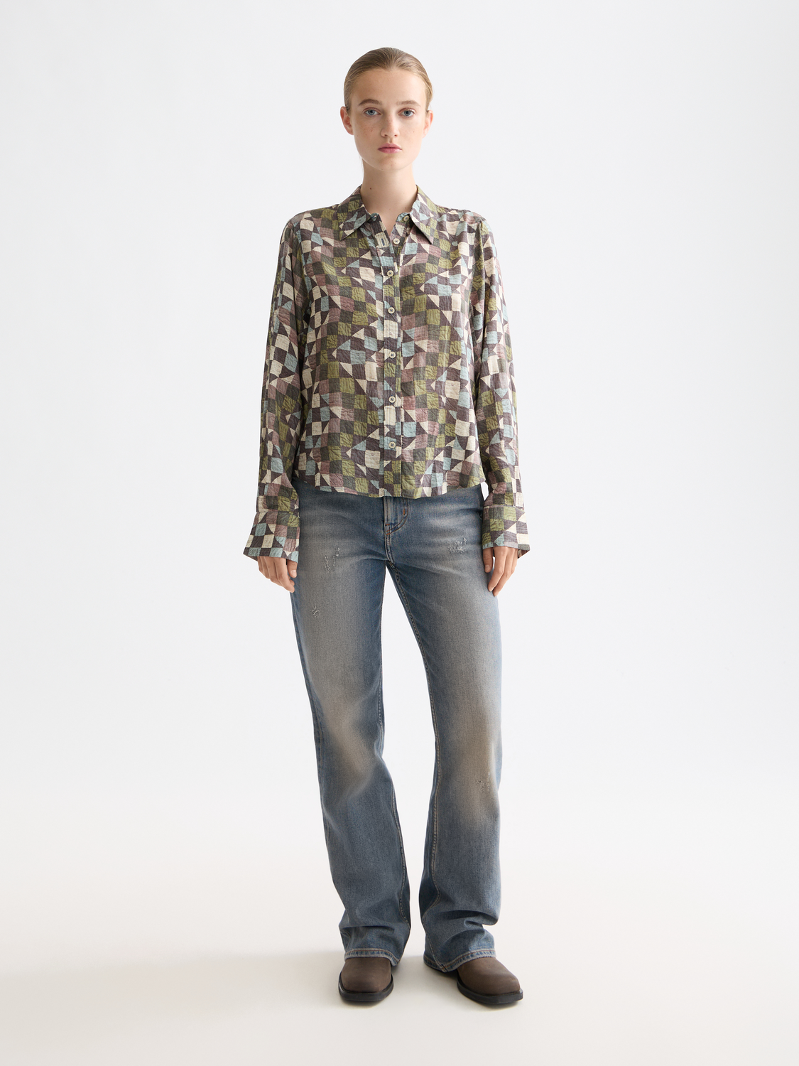 Long-sleeve printed shirt by Scotch & Soda featuring vibrant patterns and casual fit, displayed on a model.