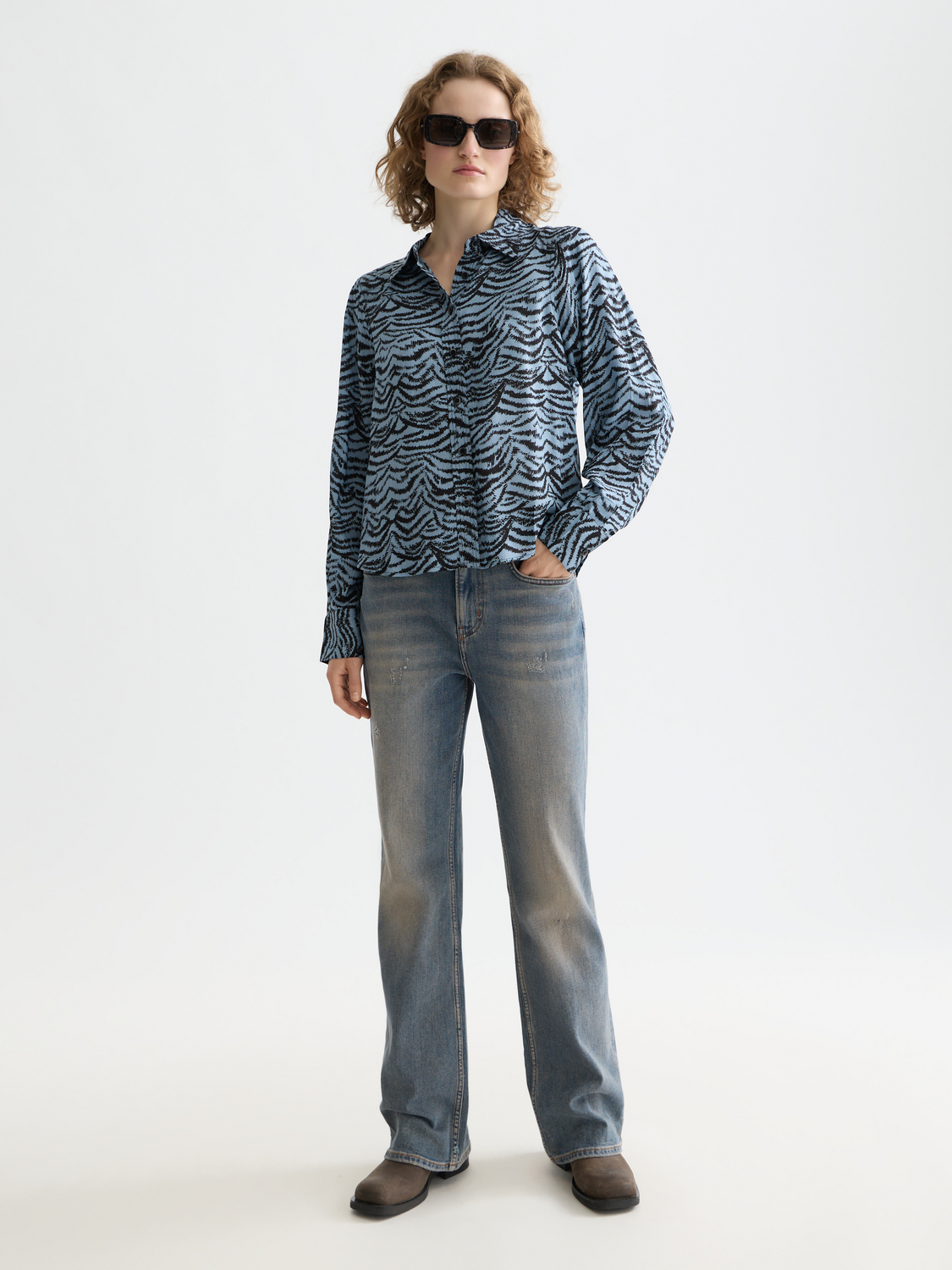 Long-sleeve printed shirt by Scotch & Soda featuring a stylish design and comfortable fit, displayed on a model.