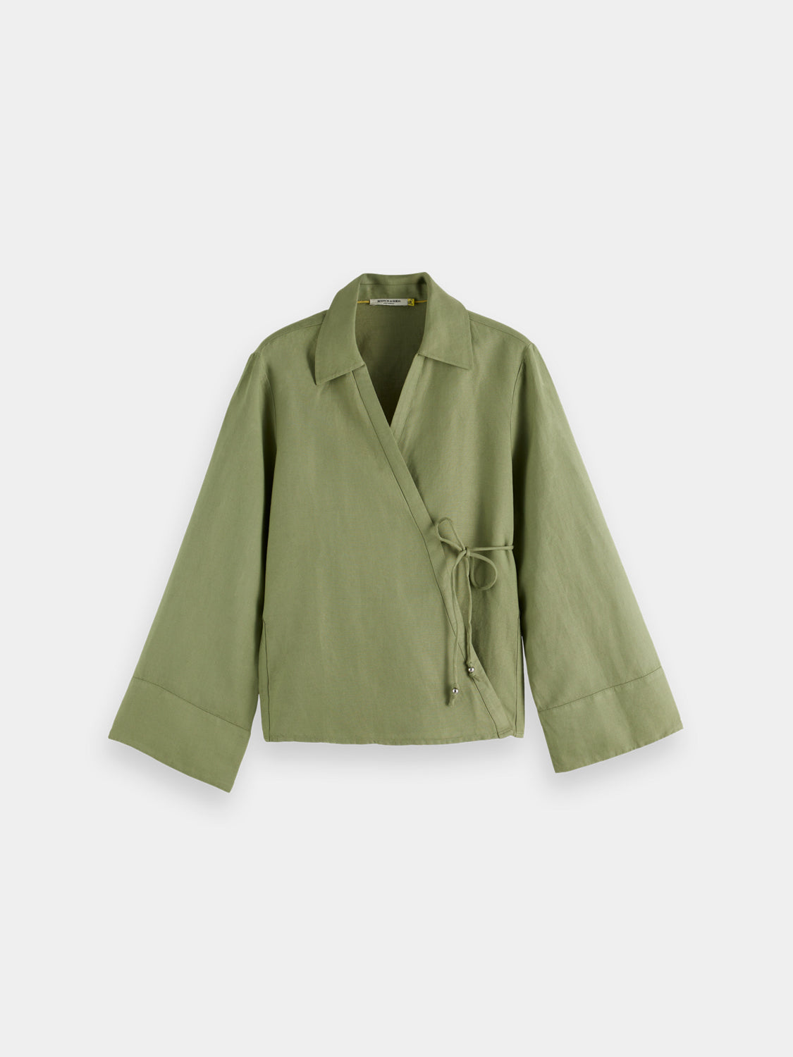 Long sleeve wrap shirt by Scotch & Soda featuring a stylish design, displayed on a hanger against a plain background.