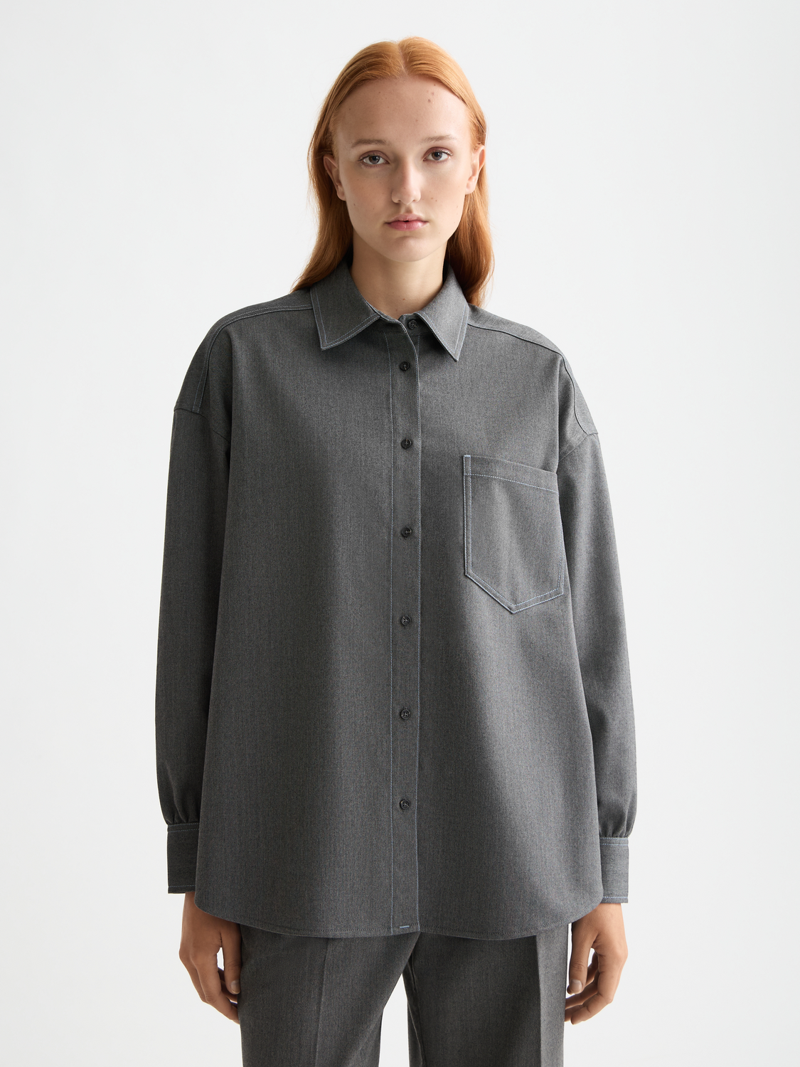 Long-sleeve Scotch & Soda girlfriend herringbone shirt displayed on a model, featuring a classic pattern and tailored fit.
