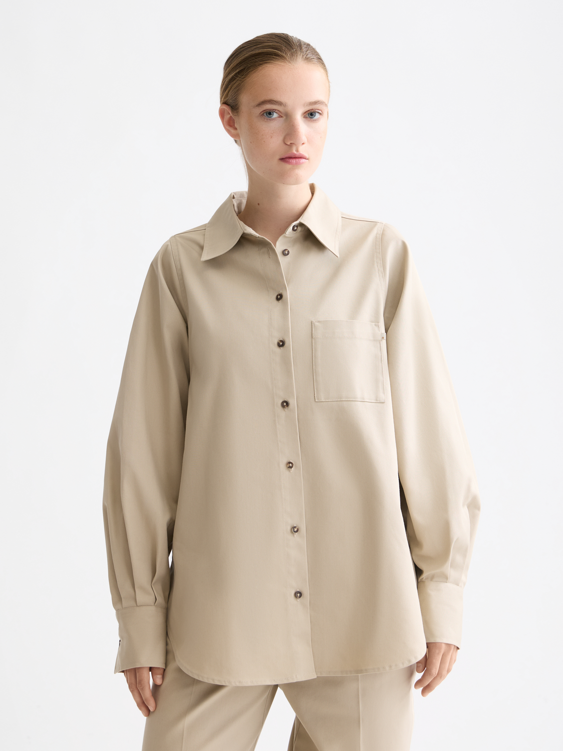 Long-sleeve Scotch & Soda contrast stitch shirt with button closure and stylish design, displayed on a model.