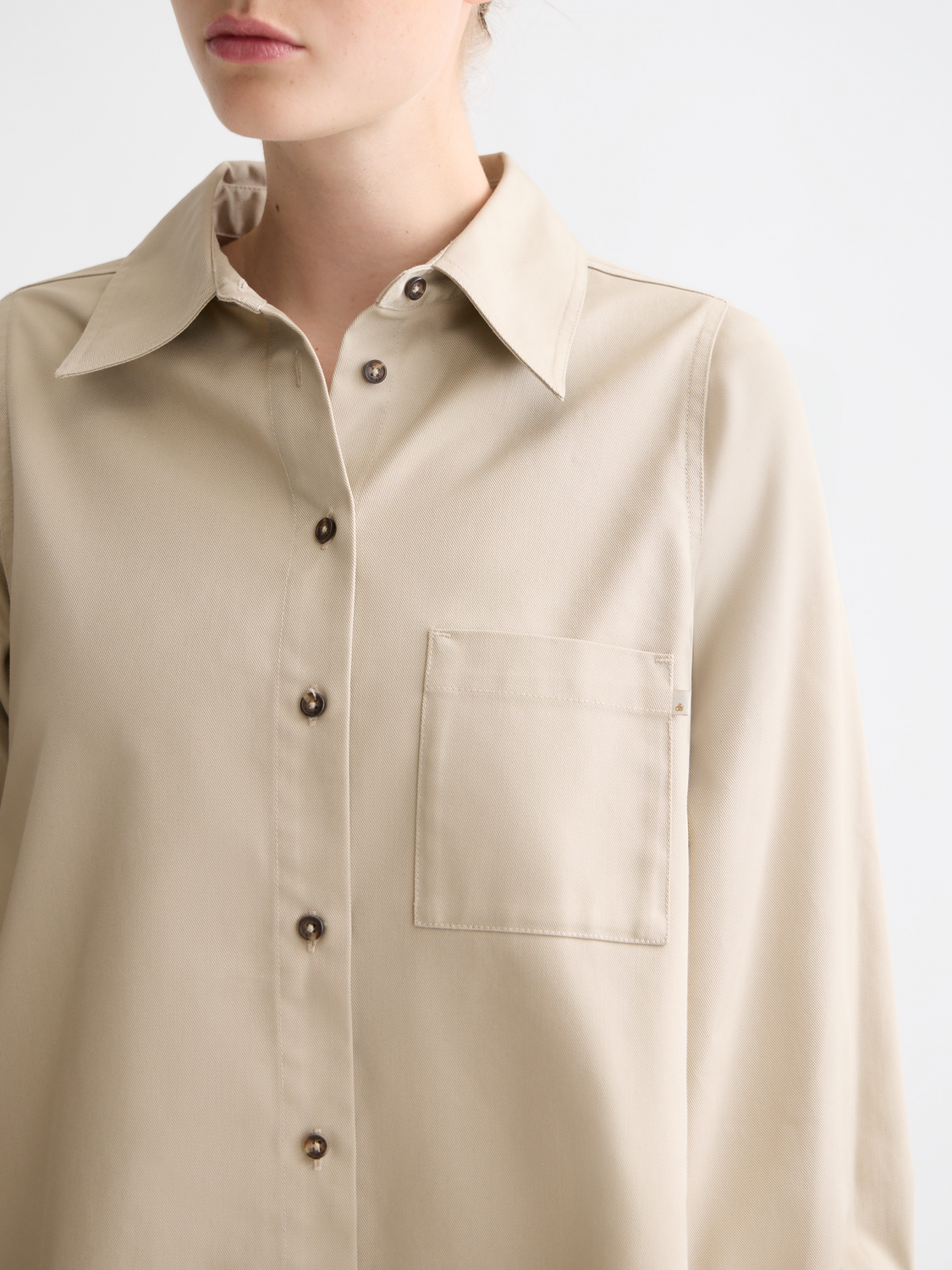 Long sleeve contrast stitch shirt by Scotch & Soda, featuring detailed stitching and casual fit, shown on a model.