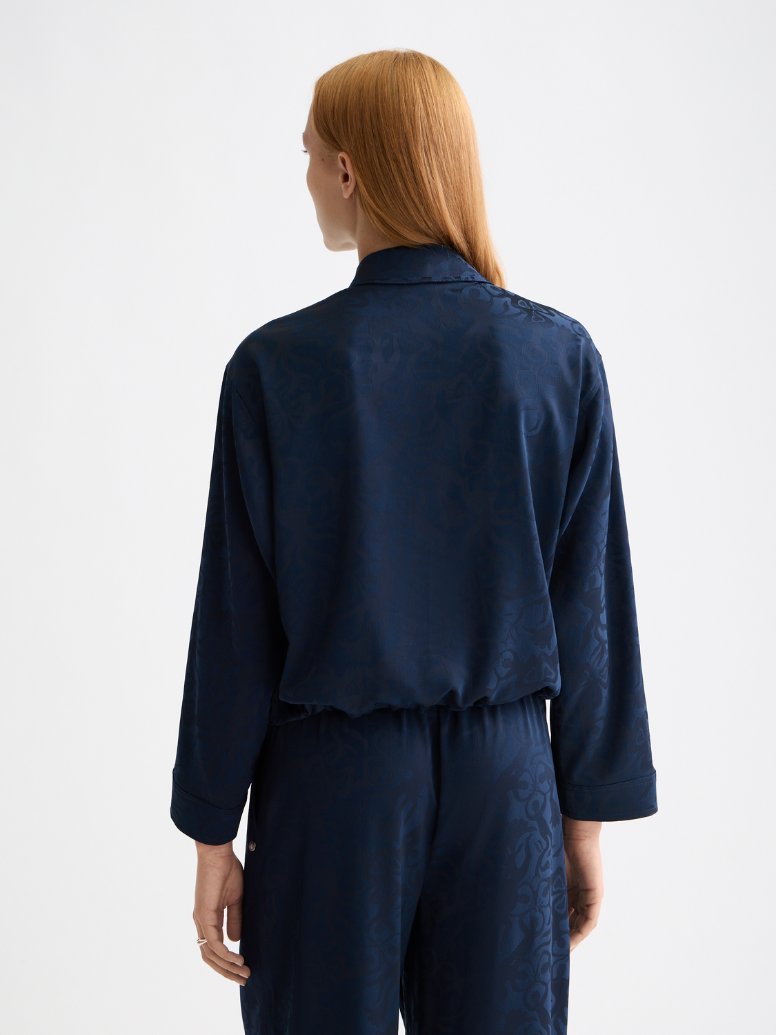 Long-sleeve utility shirt by Scotch & Soda featuring a structured design and dark color, displayed on a model.