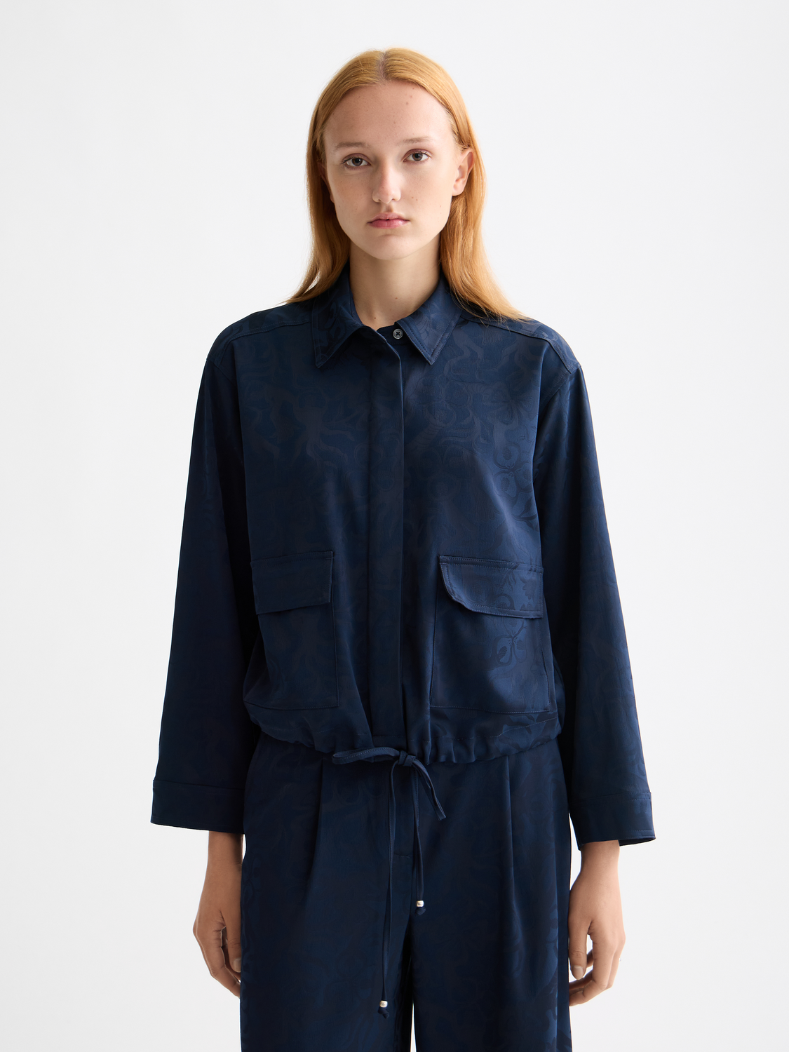 Long-sleeve utility shirt by Scotch & Soda featuring a button-up front, chest pockets, and casual style, modeled in the image.