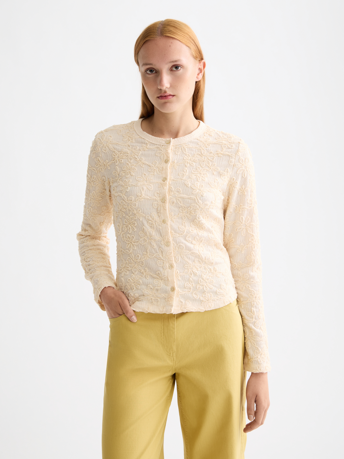 Long sleeve textured button-up top by Scotch & Soda, shown in a stylish design with a collar and button details.