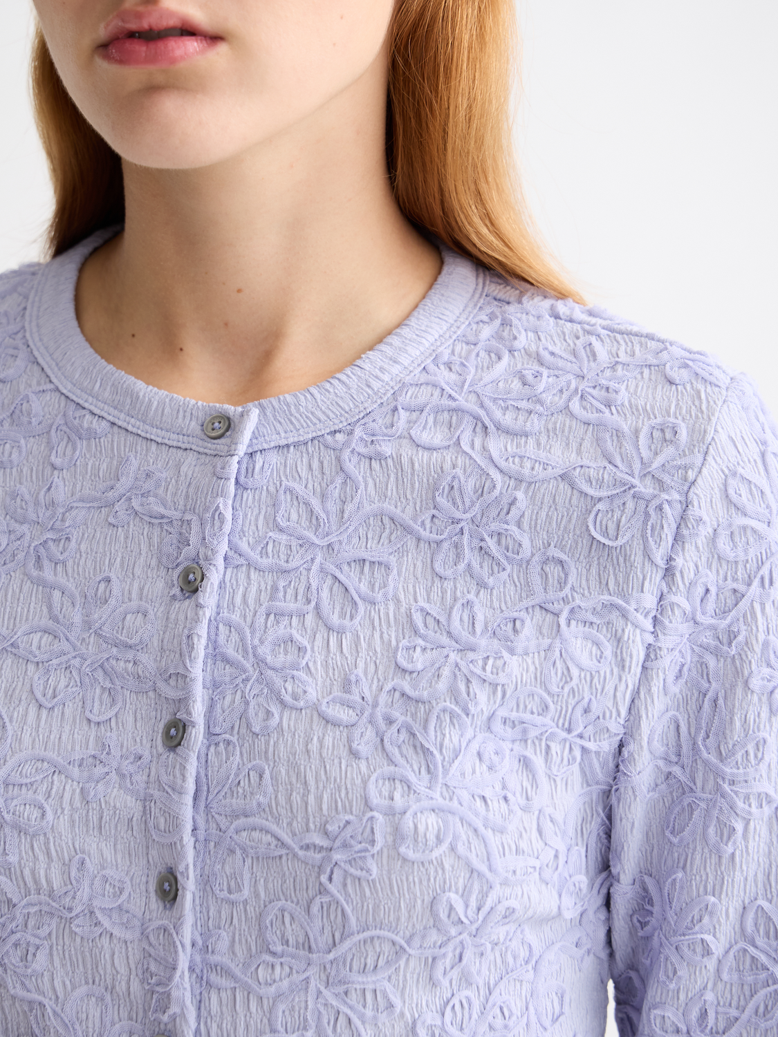 Textured long-sleeve button-up top from Scotch & Soda, showcasing a stylish, patterned design in natural fabric.