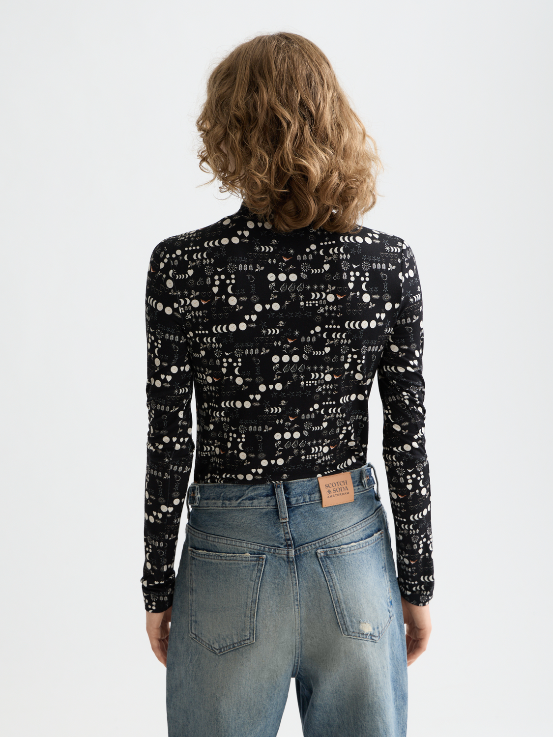 Black printed mock neck long sleeve tee from Scotch & Soda with graphic design on the front.