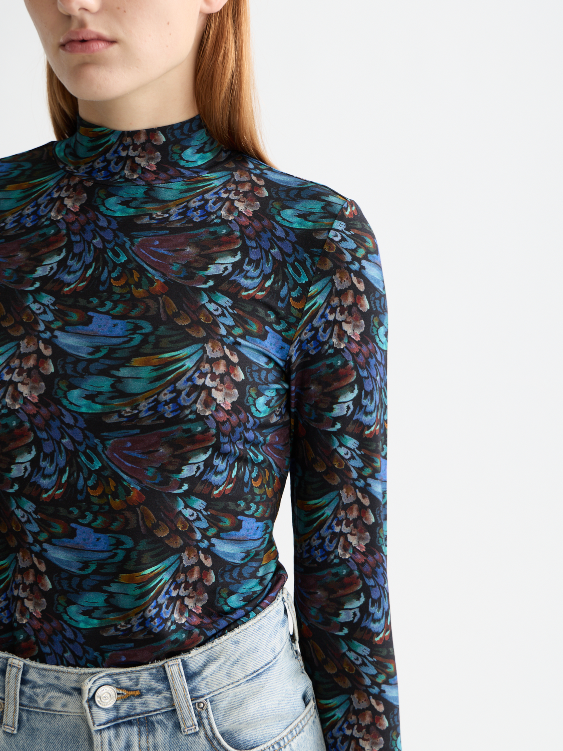 Long sleeve printed mock neck tee from Scotch & Soda with a stylish design, shown on a model.