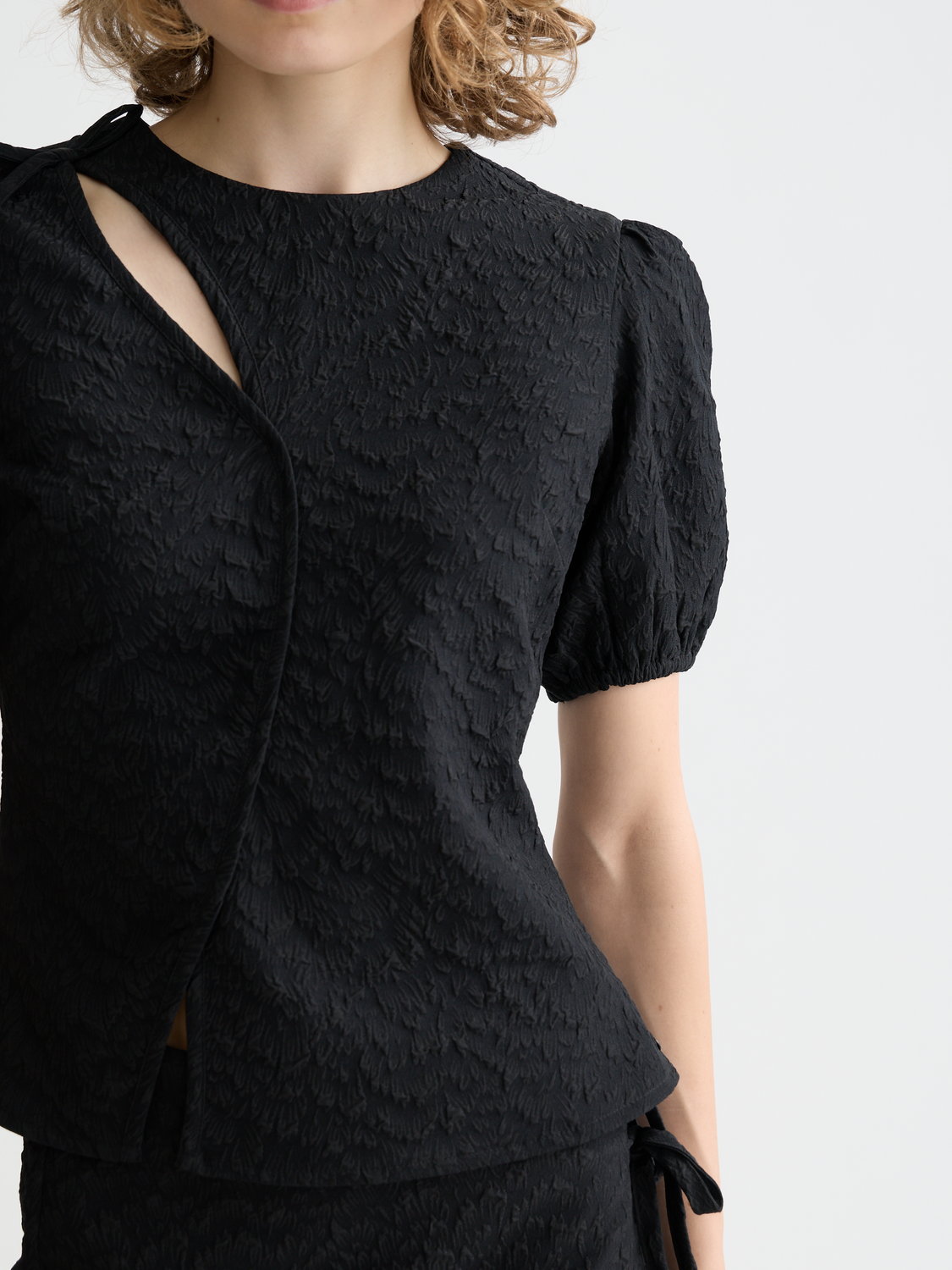 Textured woven top with puff sleeves from Scotch & Soda, showcasing its fabric detail and stylish design.