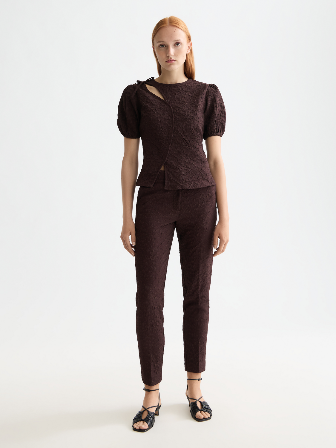 Scotch & Soda woven puff sleeve textured top shown on a model, featuring a stylish design with textured fabric and puffed sleeves.