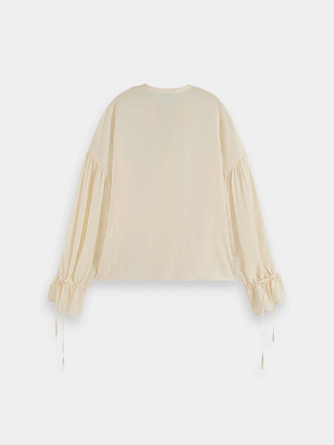 Black Scotch & Soda woven drawstring blouse with long sleeves and relaxed fit, styled with casual accessories.