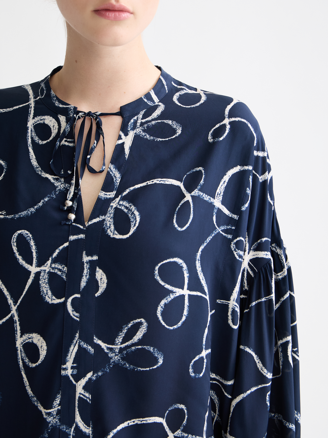 Scotch & Soda woven drawstring blouse with long sleeves and a relaxed fit, featuring a stylish, casual design.