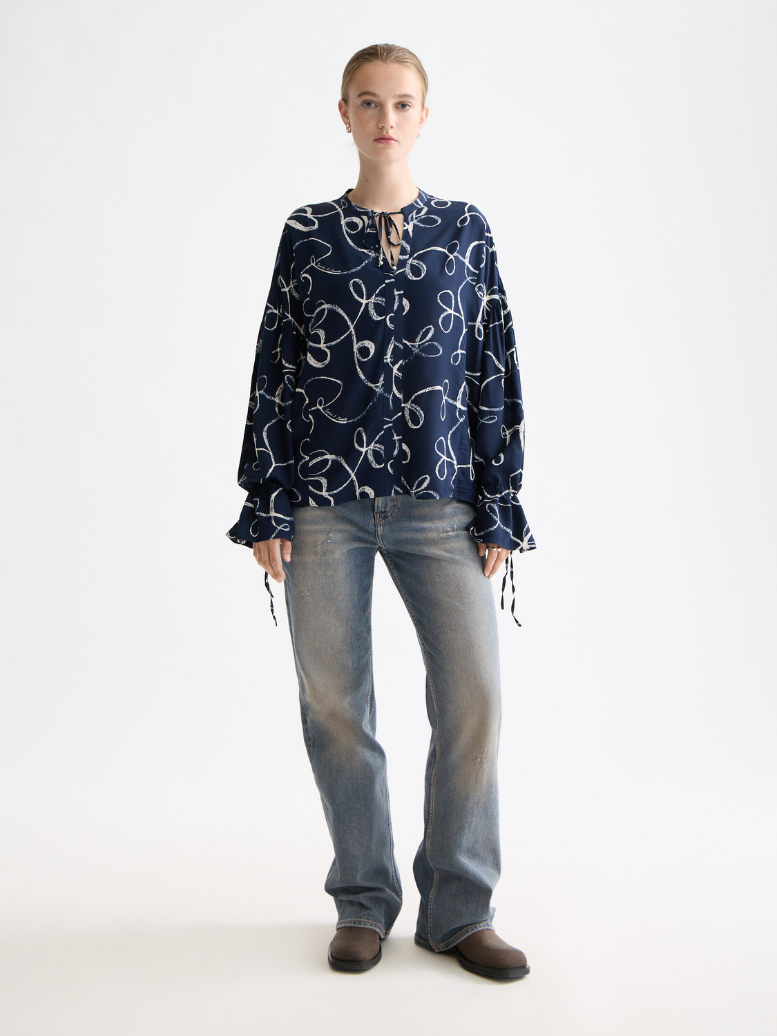 Woven drawstring blouse by Scotch & Soda featuring a relaxed fit and lightweight fabric, styled with a casual neckline.