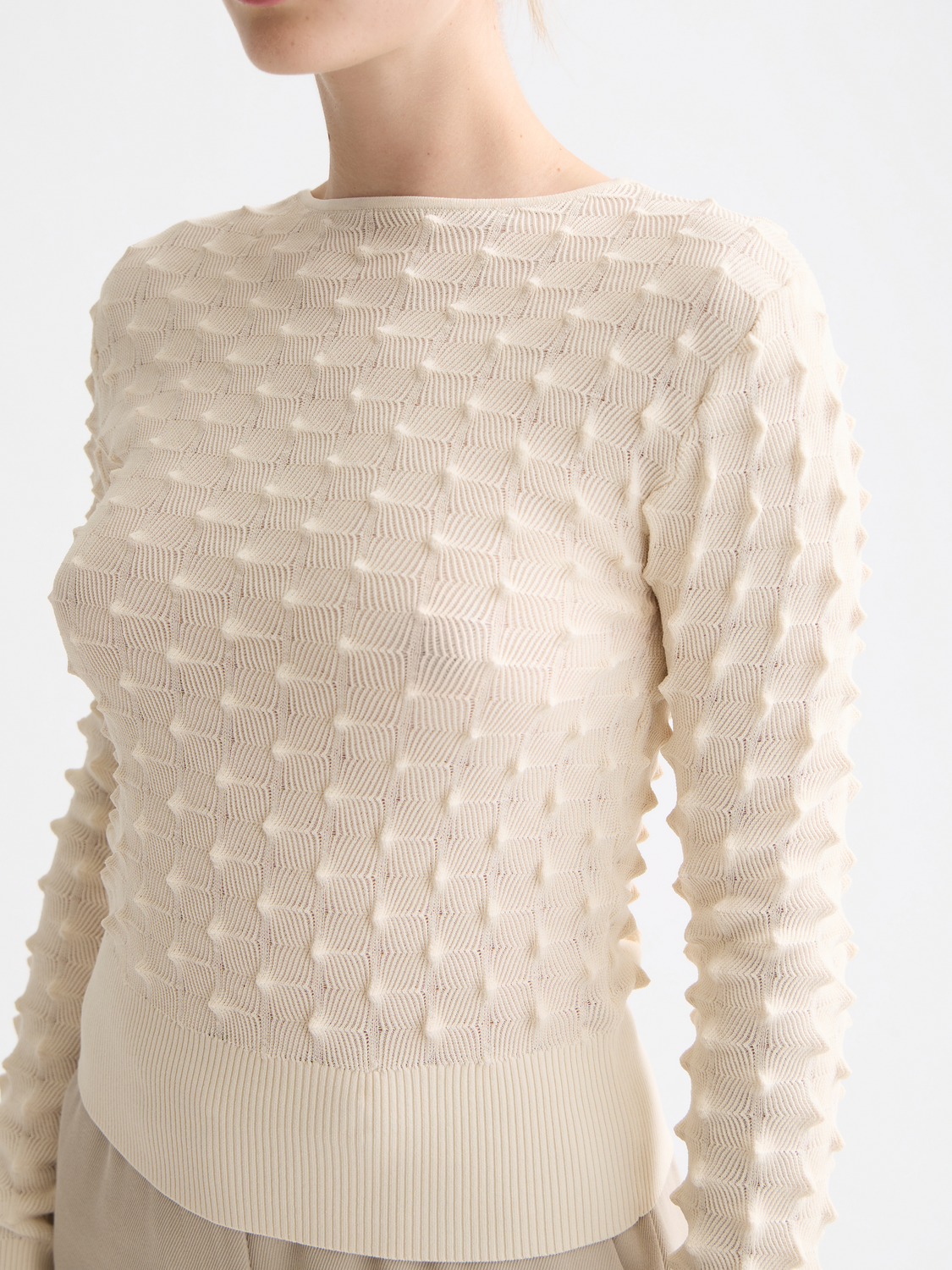 Textured stitch knitwear pullover by Scotch & Soda, showing close-up of the patterned fabric and cozy knit details.