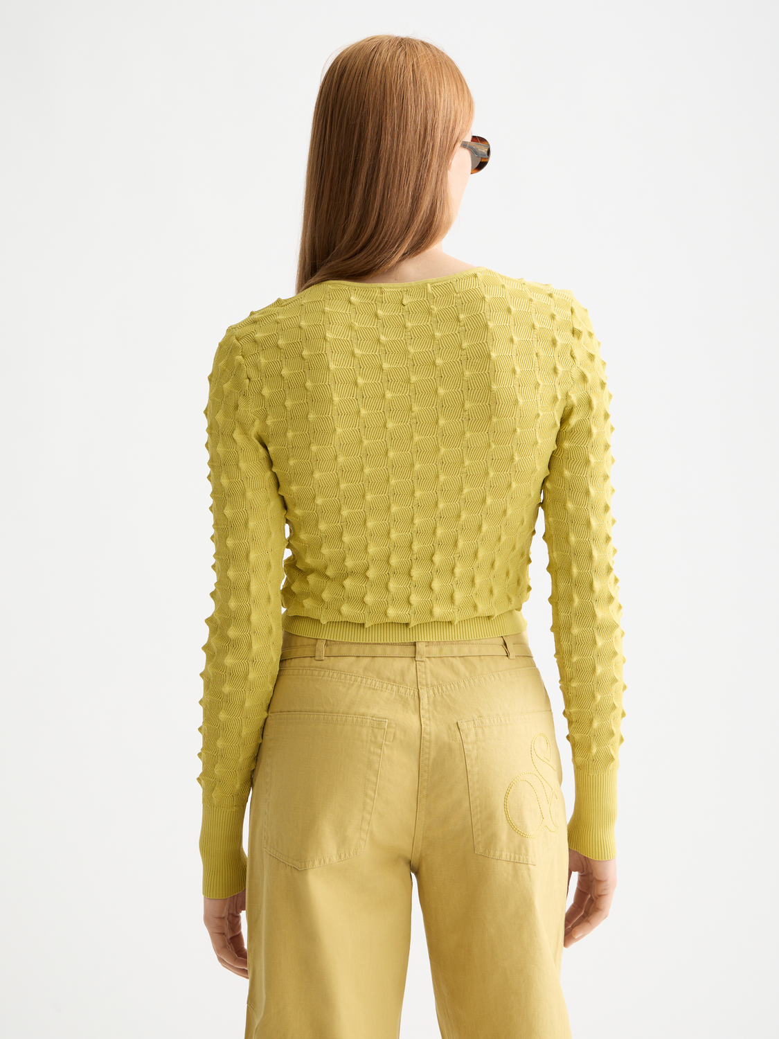 Textured stitch knitwear pullover by Scotch & Soda featuring a cozy, stylish design in a dark color with visible knit pattern.