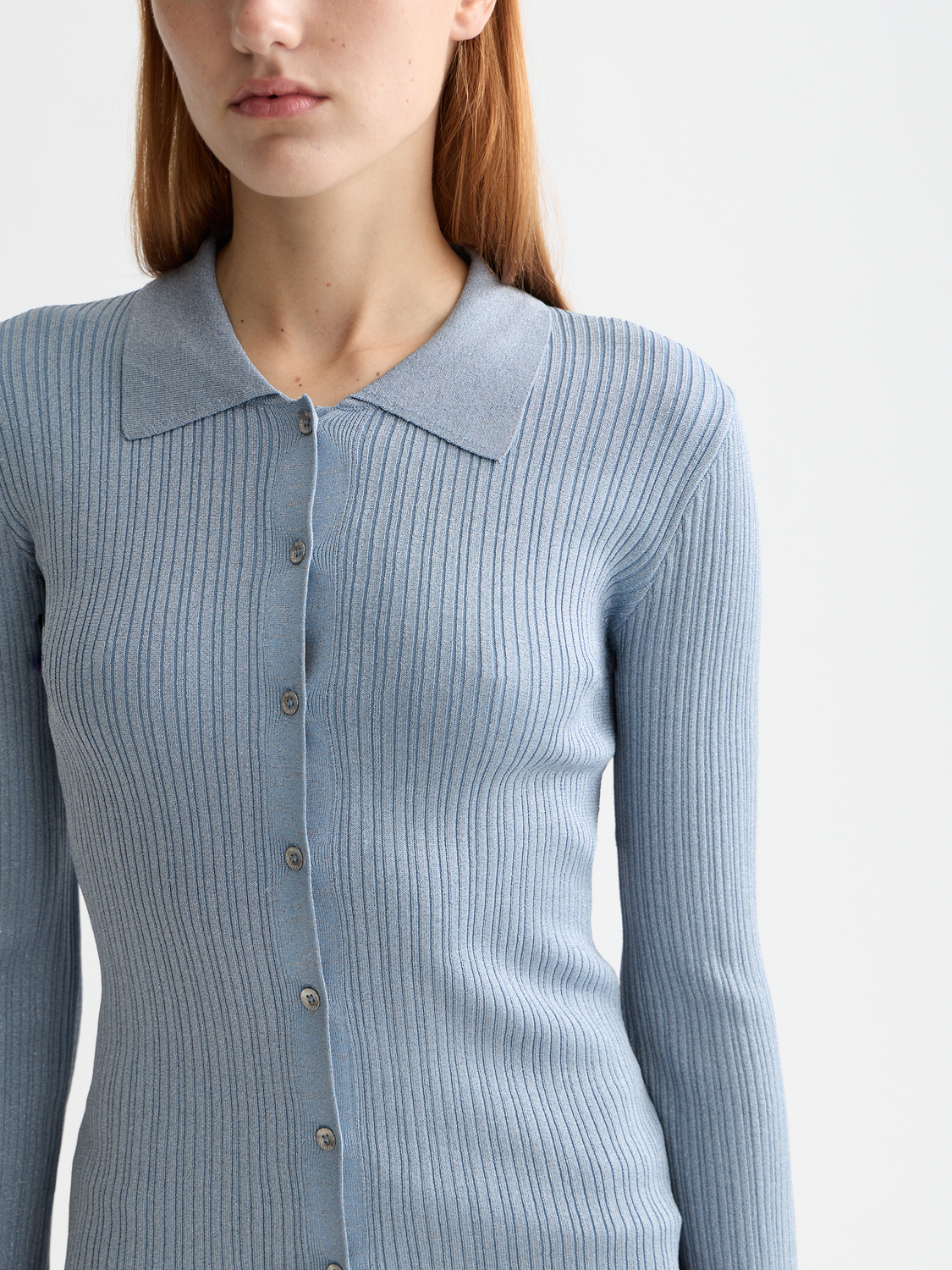 Metallic fitted button-up knitwear top by Scotch & Soda featuring a shiny, textured fabric and classic collar detail.