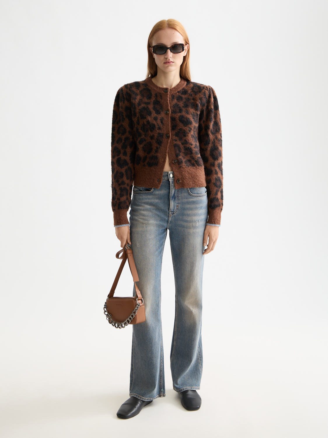 Fuzzy jacquard cardigan by Scotch & Soda, knitwear with intricate patterns, soft texture, and cozy fit visible in the image.
