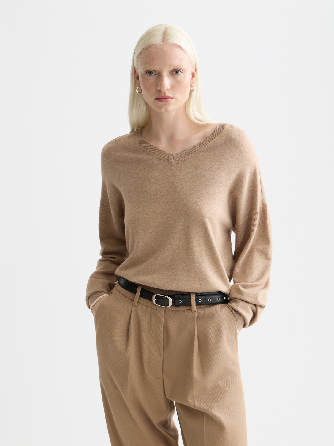 Relaxed-fit V-neck knit pullover by Scotch & Soda, showing soft fabric and classic design in a natural pose.