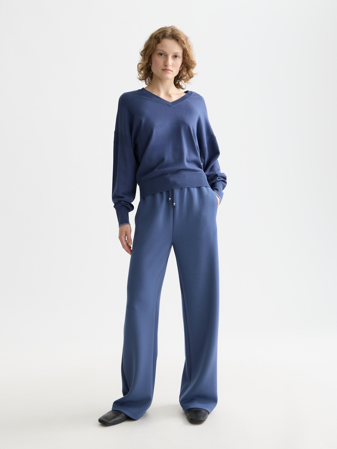 Scotch & Soda V-neck relaxed-fit knit pullover, soft fabric, worn by a model, showcasing casual style and comfortable fit.
