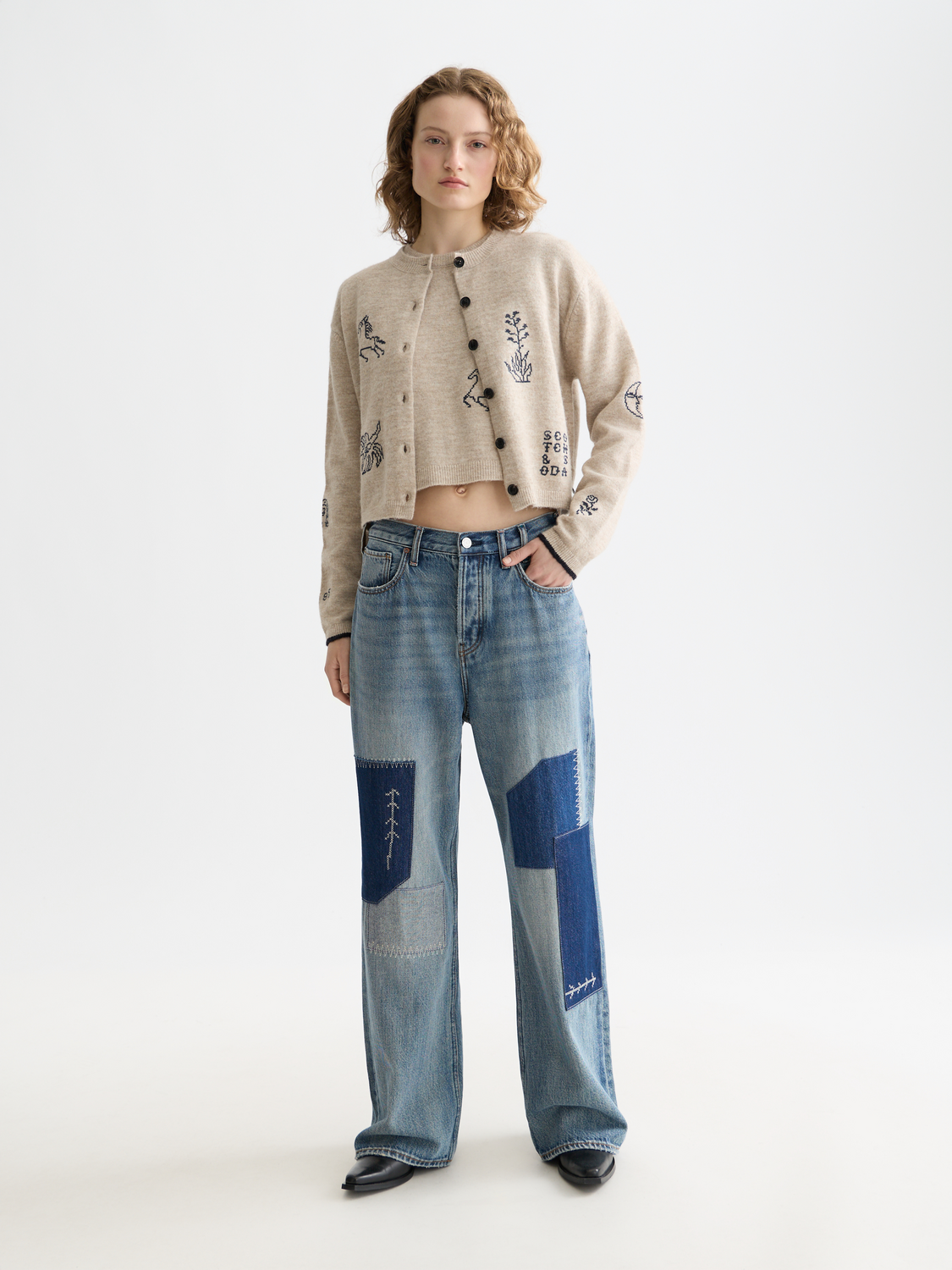 Embroidered SCOTCH & SODA knitwear crew neck cardigan with detailed embroidery and ribbed cuffs, front view.