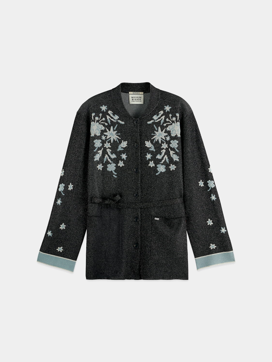 Jacquard knitted jacket by Scotch & Soda, stylish knitwear with intricate patterns, close-up of fabric texture and design details.
