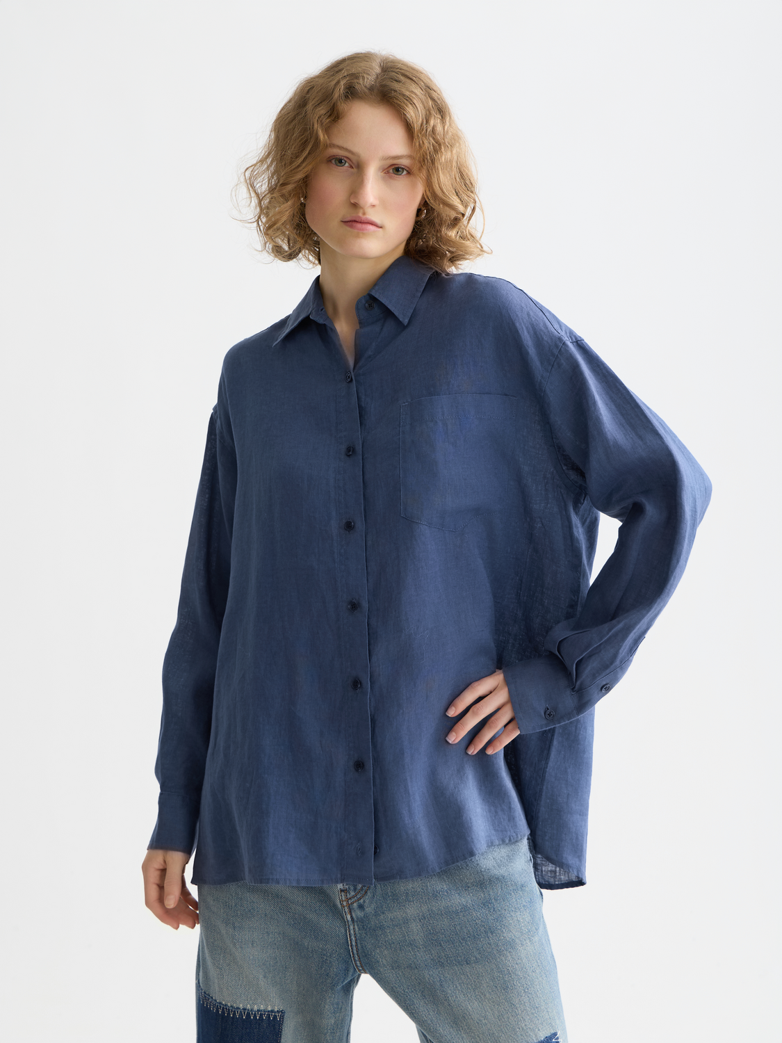Long-sleeve linen shirt by Scotch & Soda featuring a classic fit, button-up front, and natural linen fabric in a light color.