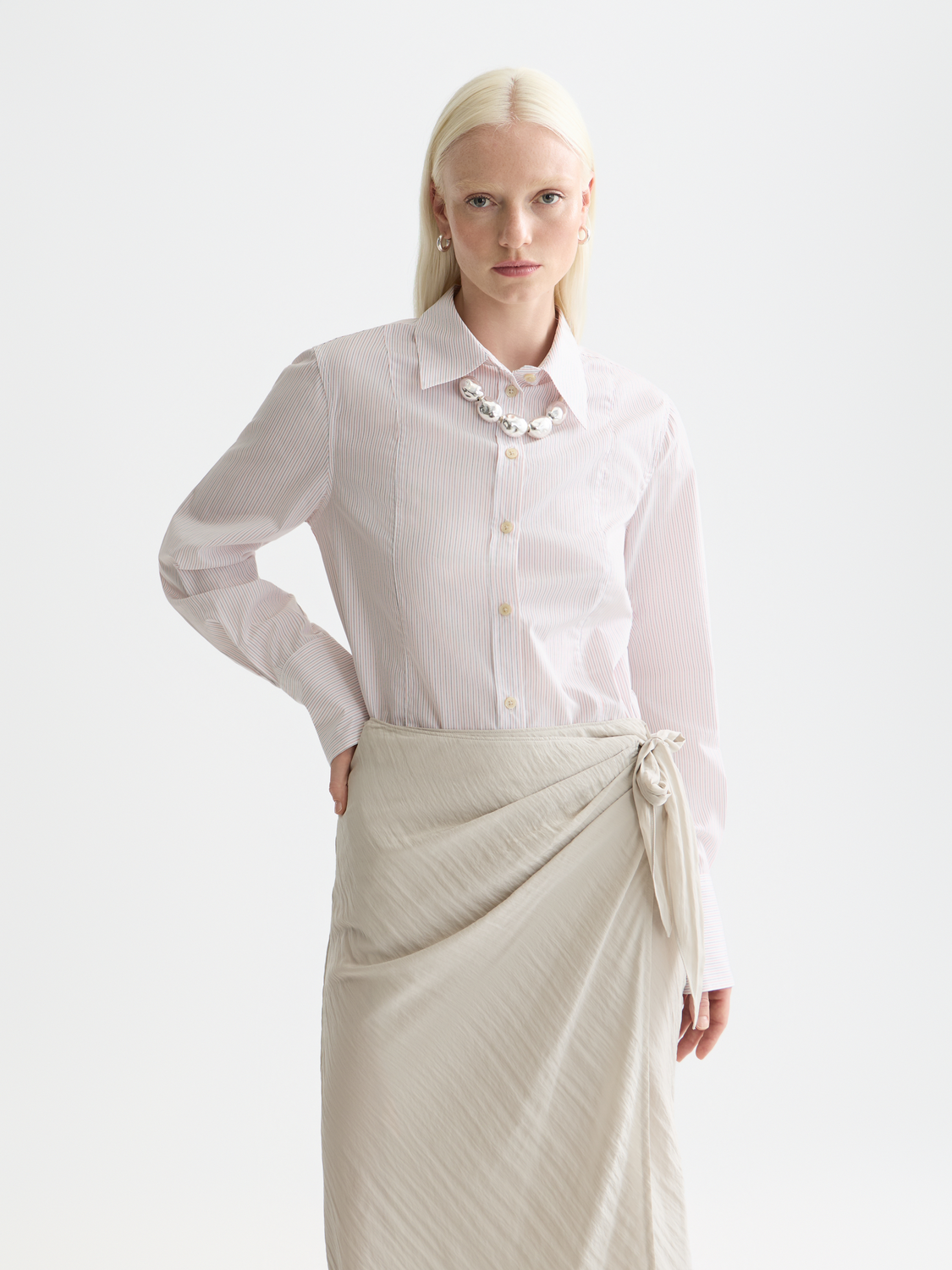 Long-sleeve Scotch & Soda poplin shirt with a classic collar and button-front detail, shown in a close-up view.