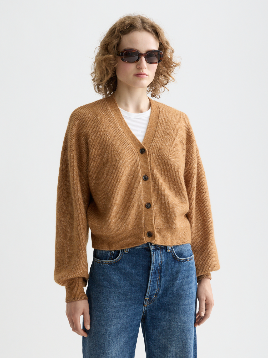 Soft fuzzy knit cardigan by Scotch & Soda, featuring a cozy texture and front button closure, displayed on a neutral background.