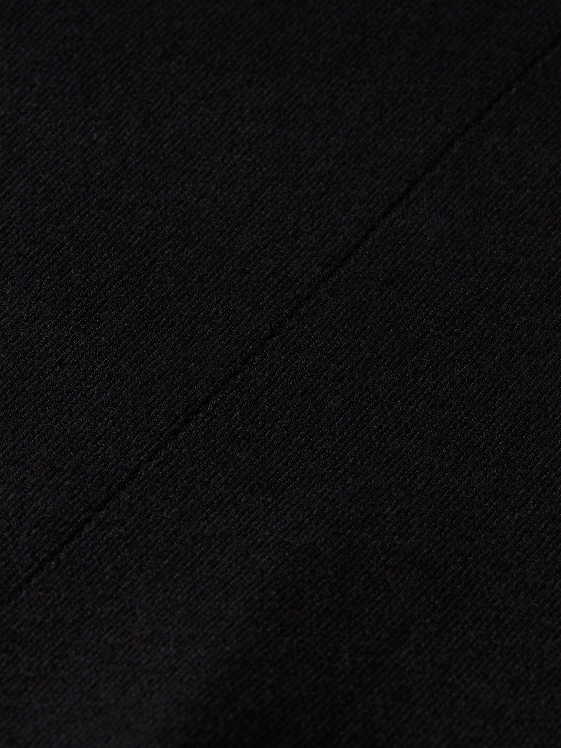 Relaxed fit Scotch & Soda knitwear roll neck pullover in soft fabric, shown in a neutral color on a mannequin.