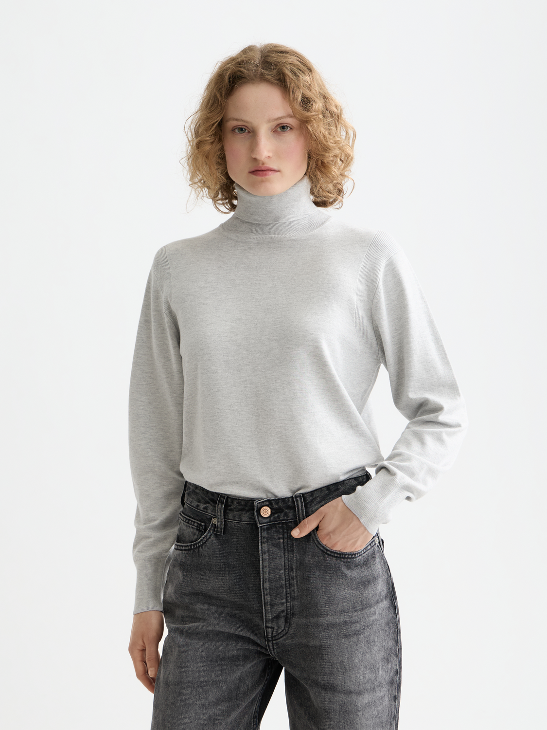 Relaxed fit Scotch & Soda knitwear roll neck pullover in soft fabric, shown in a neutral color with a cozy, casual style.