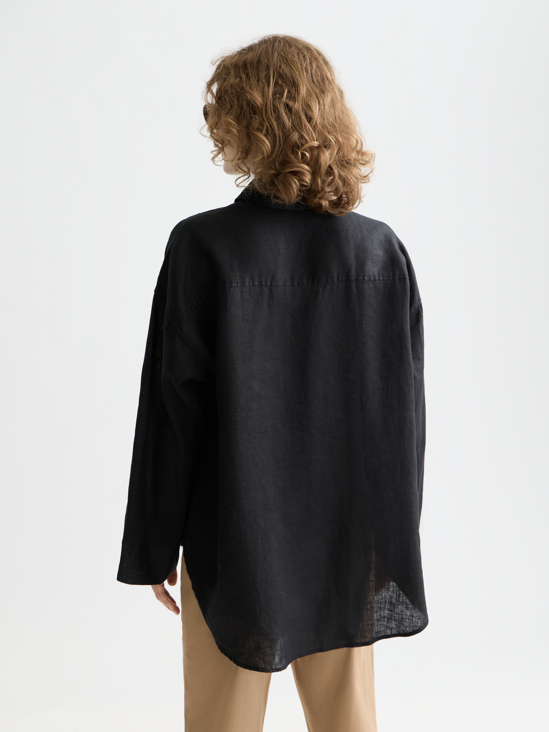 Long-sleeve linen shirt by Scotch & Soda, showing the back view with a relaxed fit and natural fabric texture.