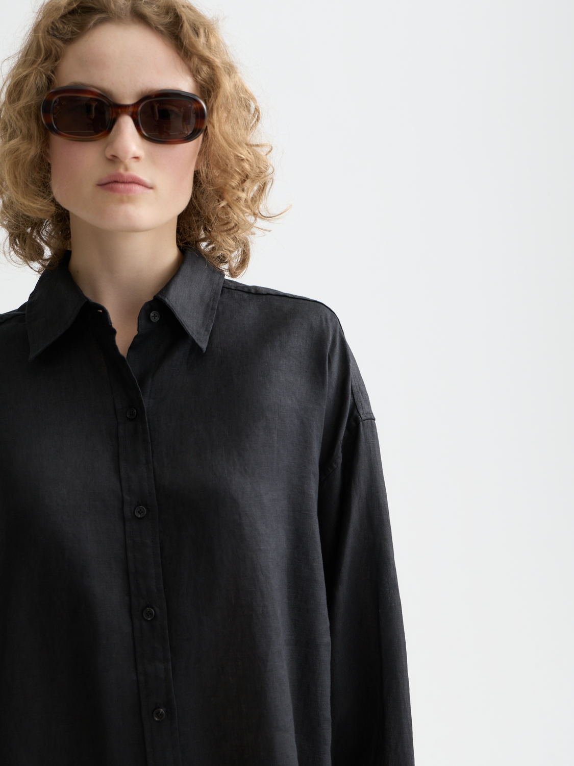 Long-sleeve Scotch & Soda linen shirt displayed on a model, featuring a relaxed fit and lightweight fabric for casual wear.