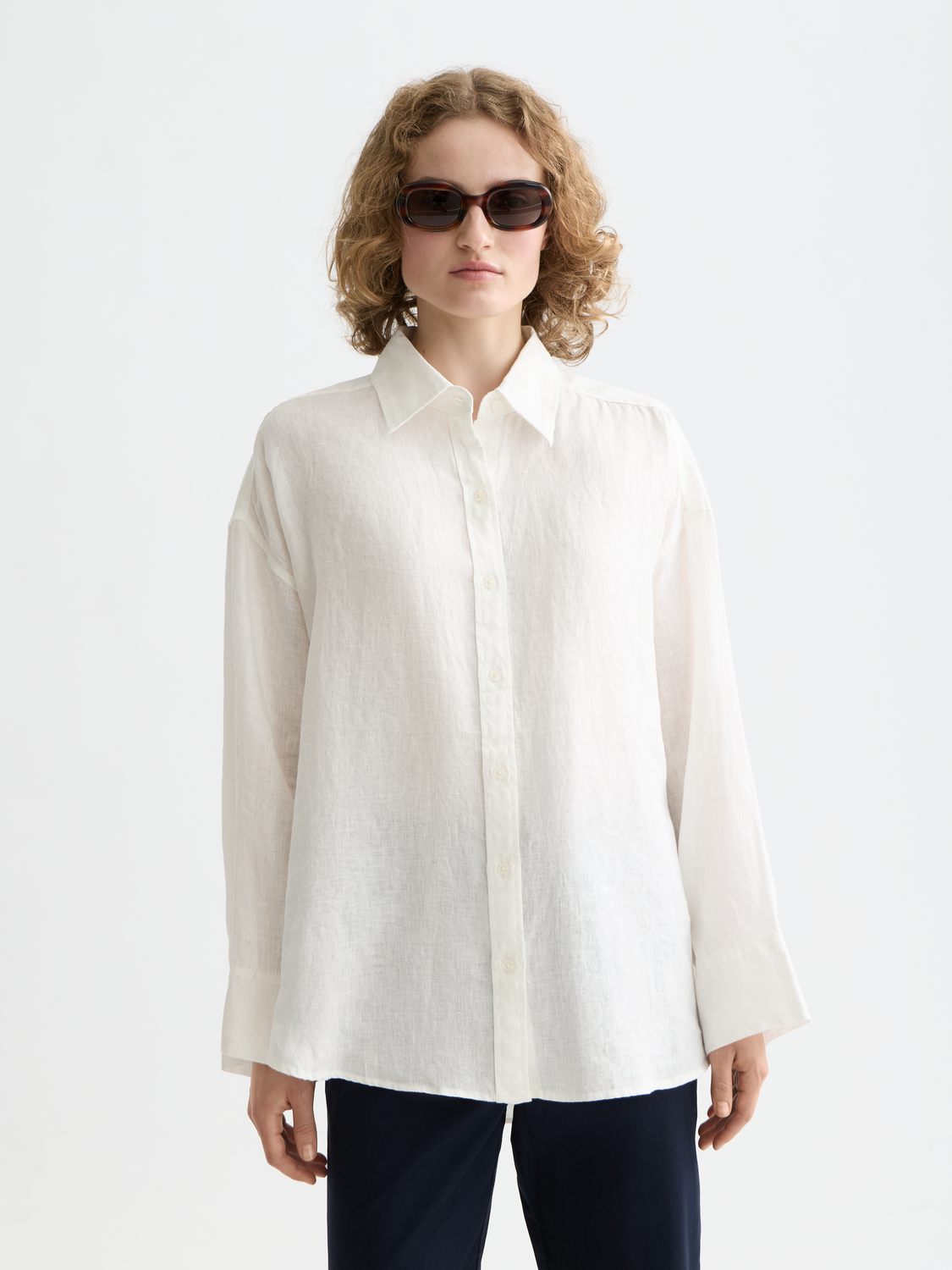 Long-sleeve linen shirt by Scotch & Soda, shown in a close-up of the front with a relaxed fit and natural linen fabric.
