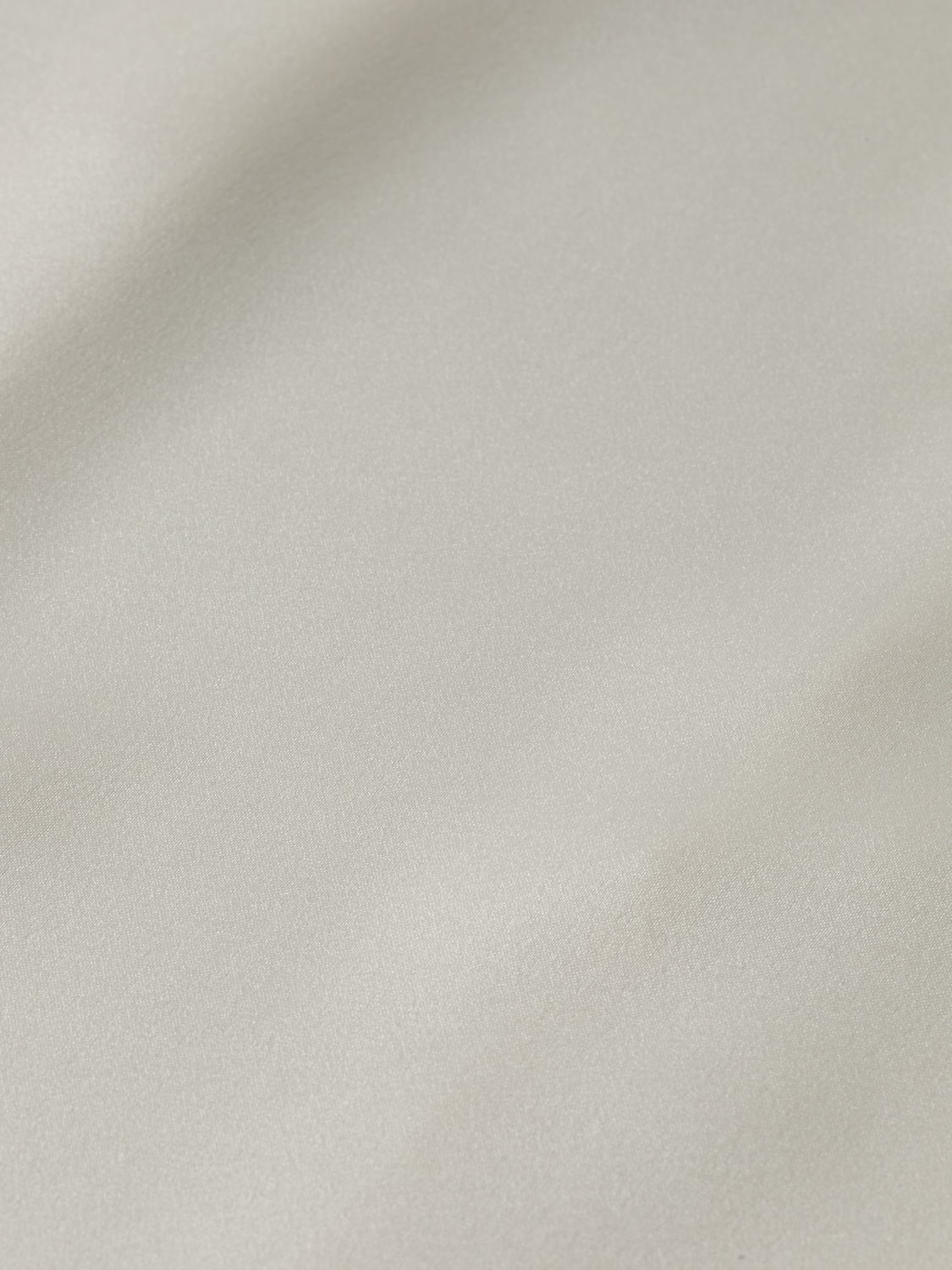Long-sleeve satin shirt by Scotch & Soda, featuring a smooth, shiny fabric and tailored fit, displayed on a hanger.