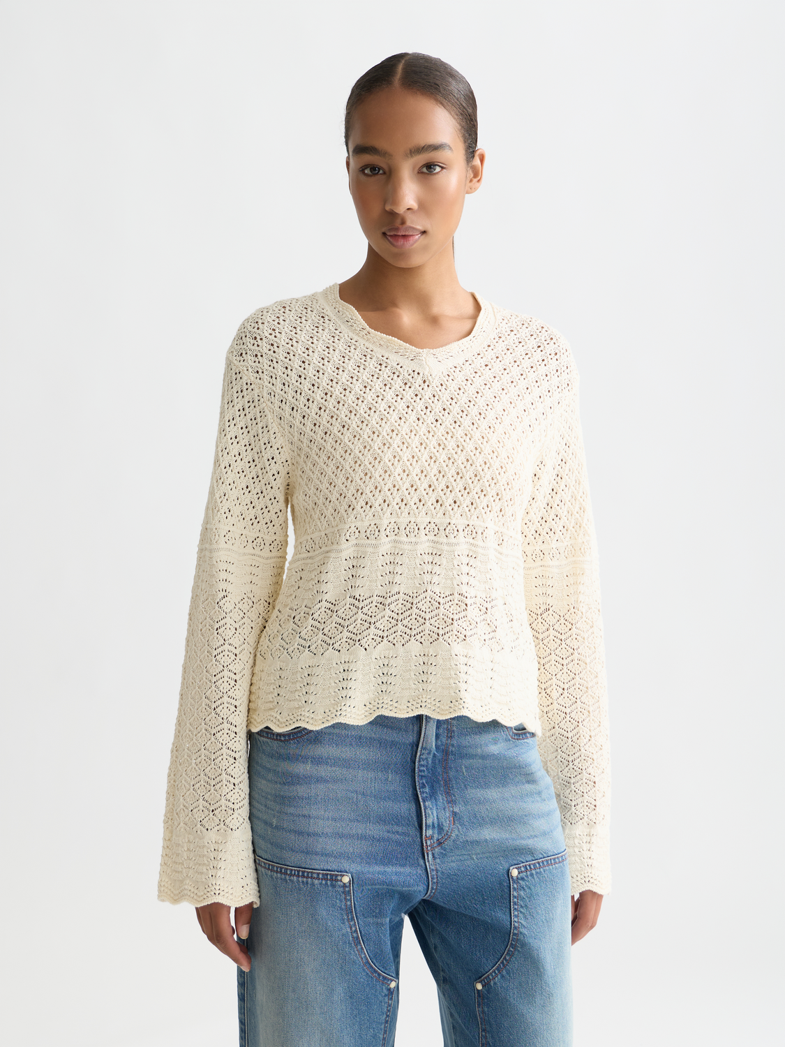 Pointelle v-neck knitwear pullover by Scotch & Soda, featuring a soft, textured fabric and a stylish v-neck design.
