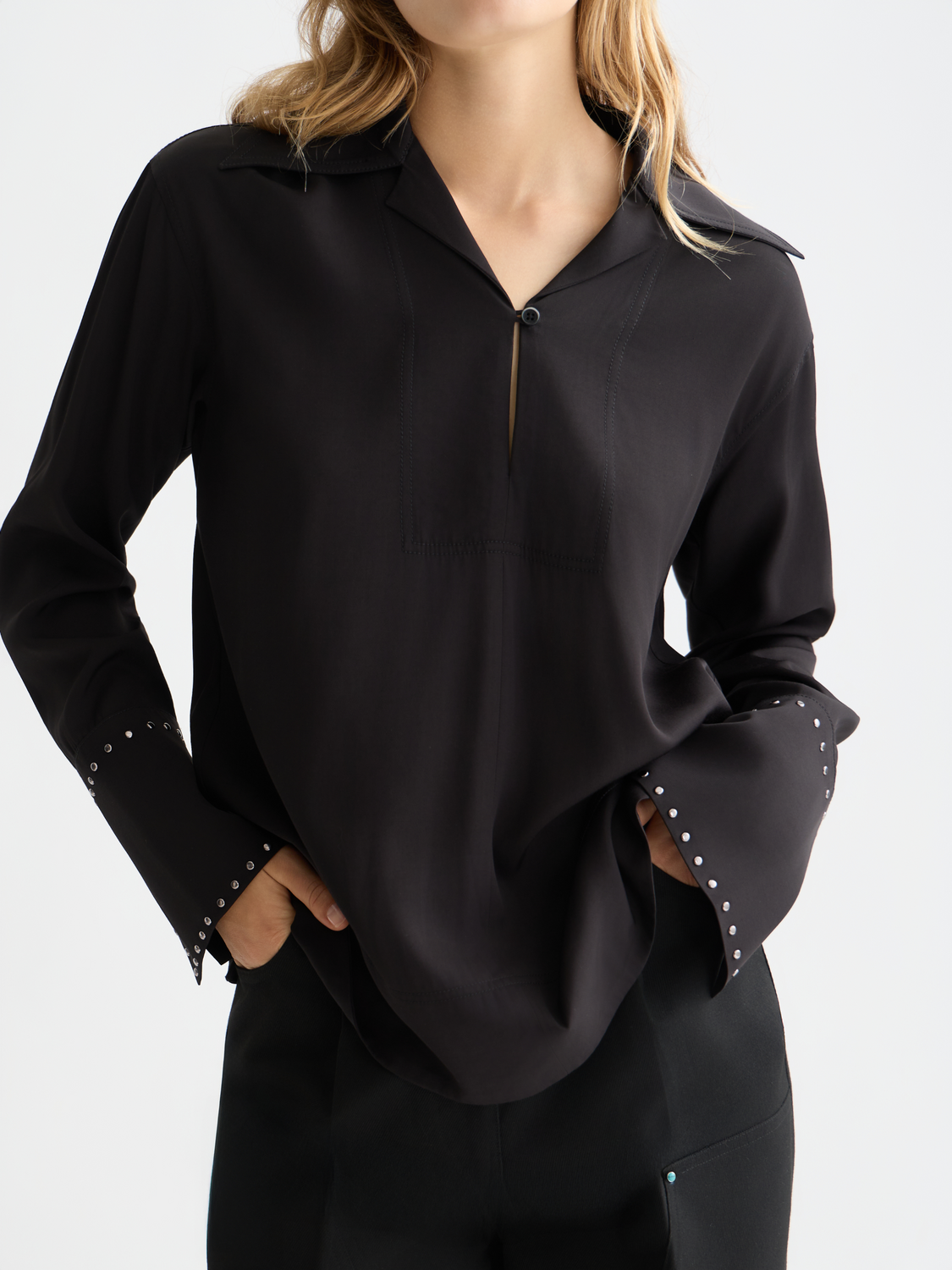 Black woven studded shirt by Scotch & Soda with metal stud accents, long sleeves, and a classic collar.