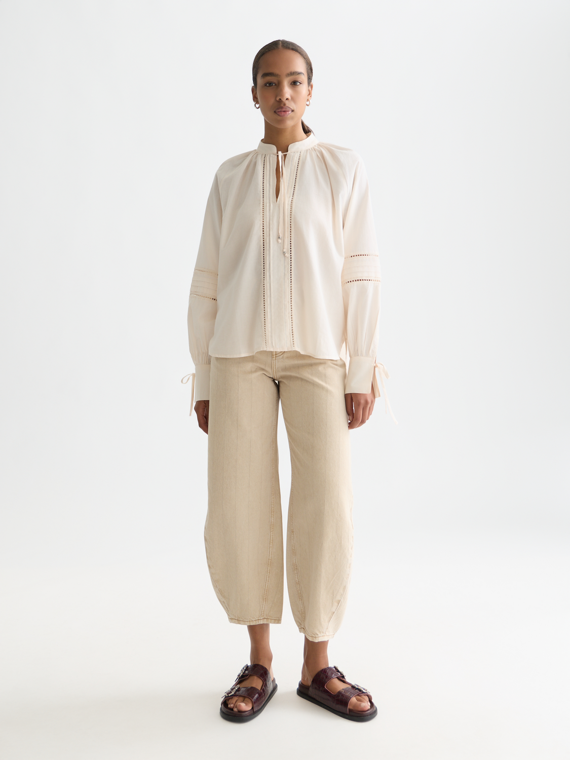 Woven pleated blouse by Scotch & Soda featuring a relaxed fit and lightweight fabric, shown in a close-up of the front design.