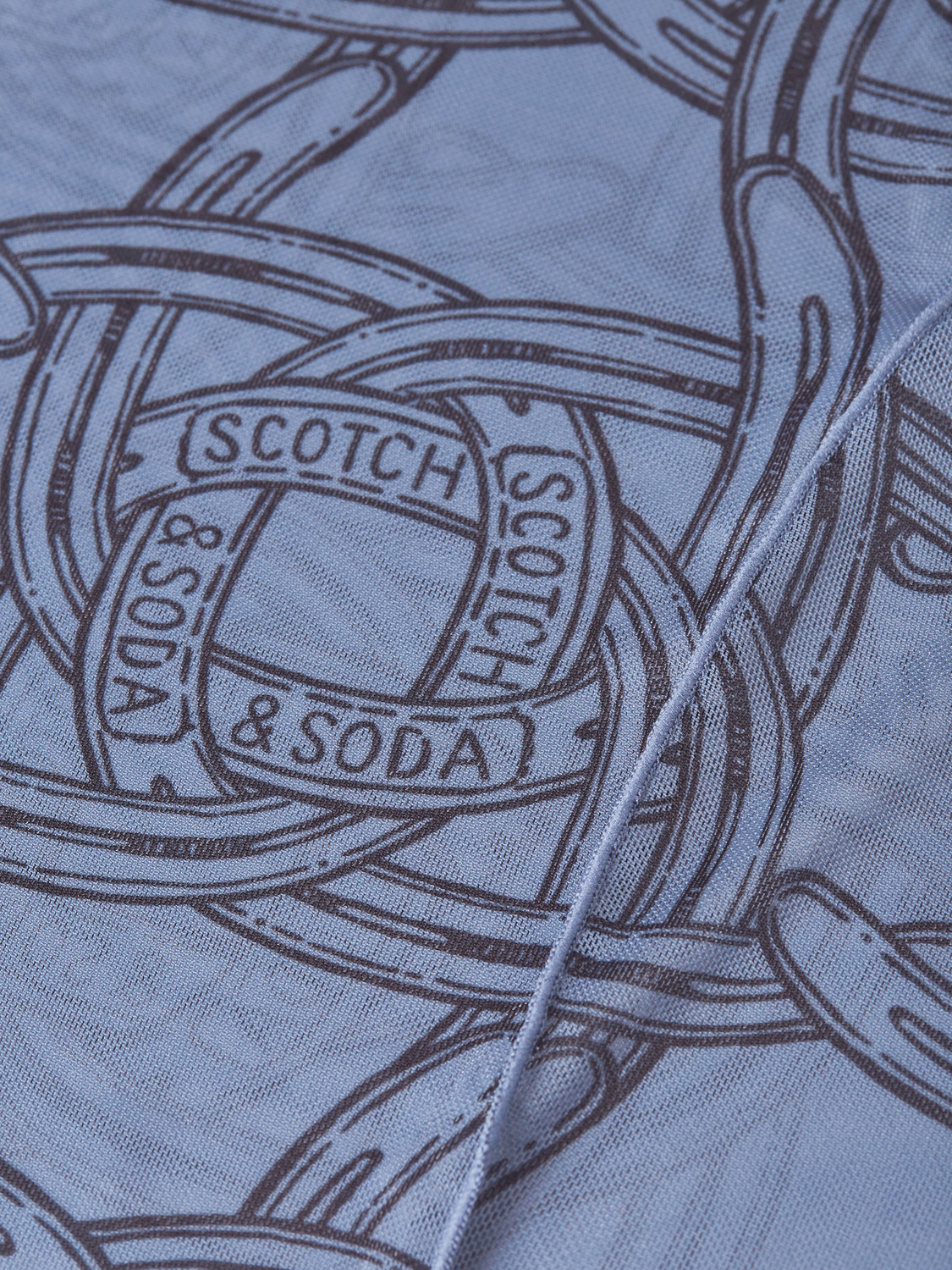 Mesh long-sleeved T-shirt by Scotch & Soda featuring breathable fabric and a stylish fit, shown on a model.