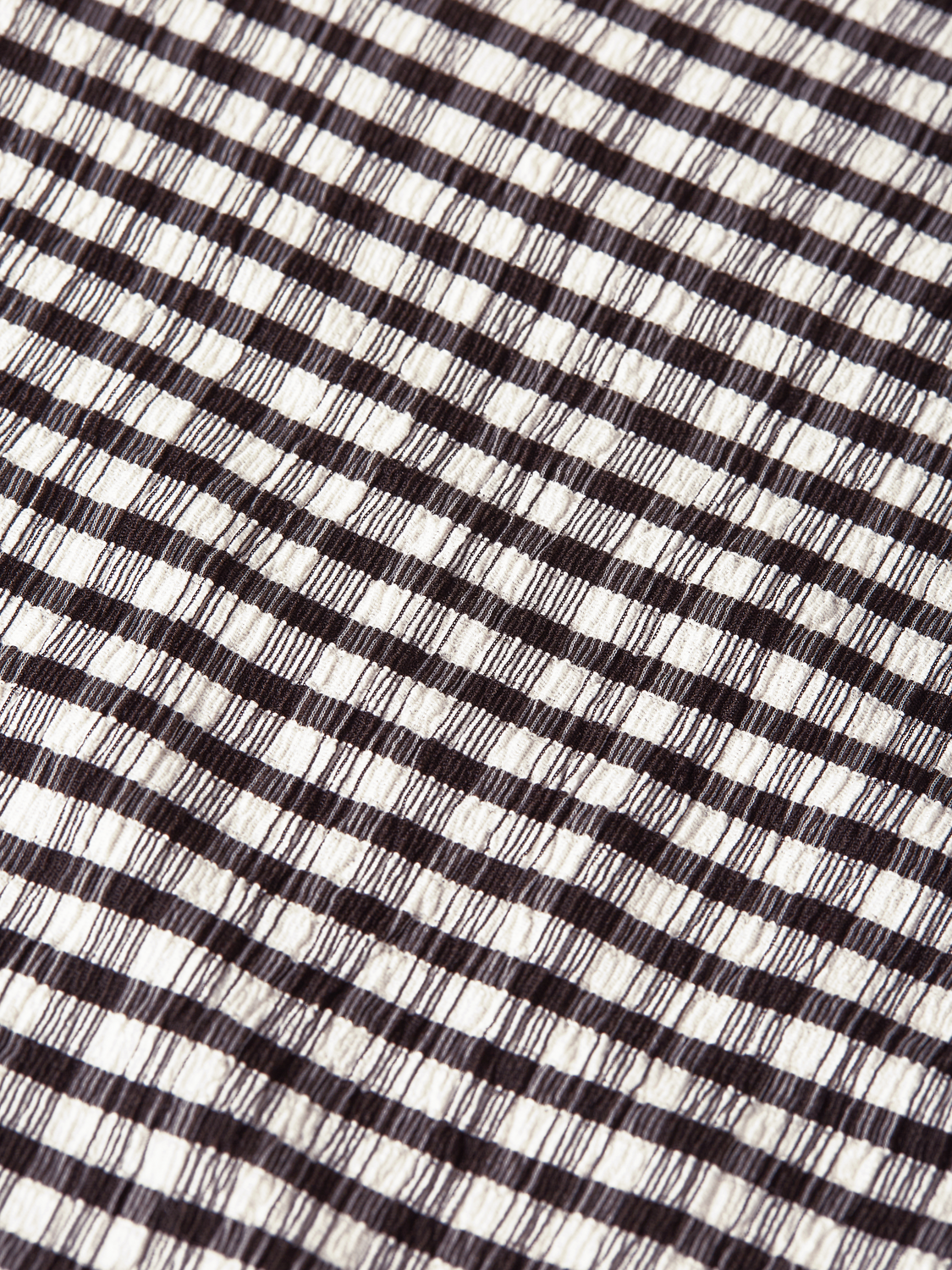 Gingham long-sleeved T-shirt by Scotch & Soda, featuring a classic checkered pattern and fitted long sleeves.